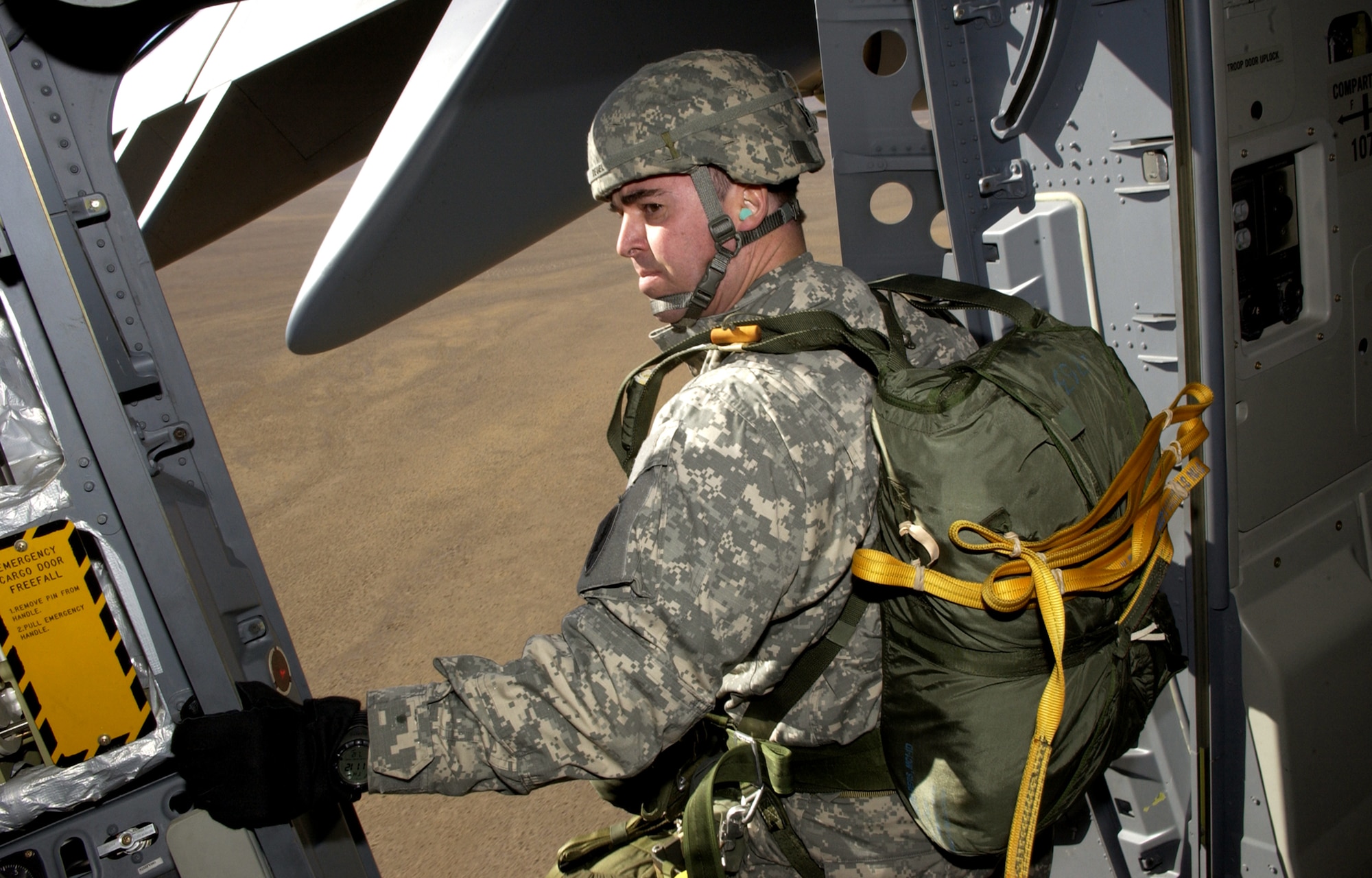 Army Maj. George Deuel, 426th Civil Affairs Battalion, Upland, Calif. prepares to exit a C-17 Globemaster III Dec.8, during a Mission Employment Exercise held at Nellis Air Force Base, Nev. The ME Phase is the final stage of a five-and a- half month course, which trains students in their specialties. Nearly 80 aircraft from both the Air Force and Navy will participate in the nearly two-week event. Mission Employment is the final event prior to Weapons School graduation. (U.S. Air Force photo/Master. Sgt. Kevin J. Gruenwald)    

 

