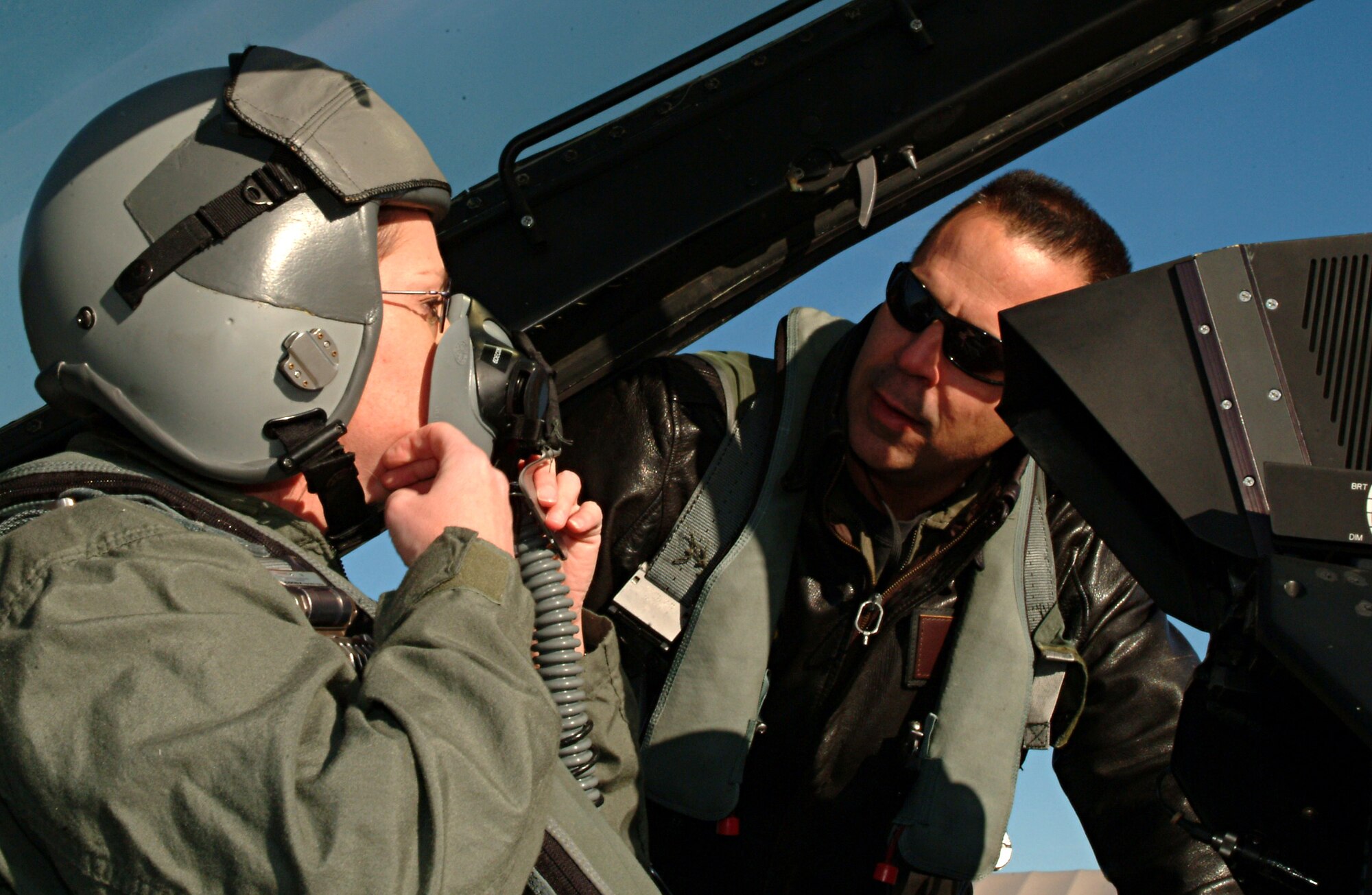 EGLIN AIR FORCE BASE, Fla. -- Tech. Sgt. Julie Morris, 16th Electronic Warfare Squadron, checks the fit and oxygen flow of her flight helmet, with pilot Lt. Col. Sam Shaneyfelt, 85th Test and Evaluation Squadron director of staff, before her incentive flight in a F-16 Dec. 8. 
“The flight was awesome!  It was even better than I imagined it would be,” said the 2005 NCO of the year. “It was really cool going supersonic.  It was definitely the best experience ever!  And one I’ll never forget.” 
Sergeant Morris is married to Master Sgt. Scott Morris and they have six children. (U.S. Photo by Tech. Sgt Andrew Leonhard)
