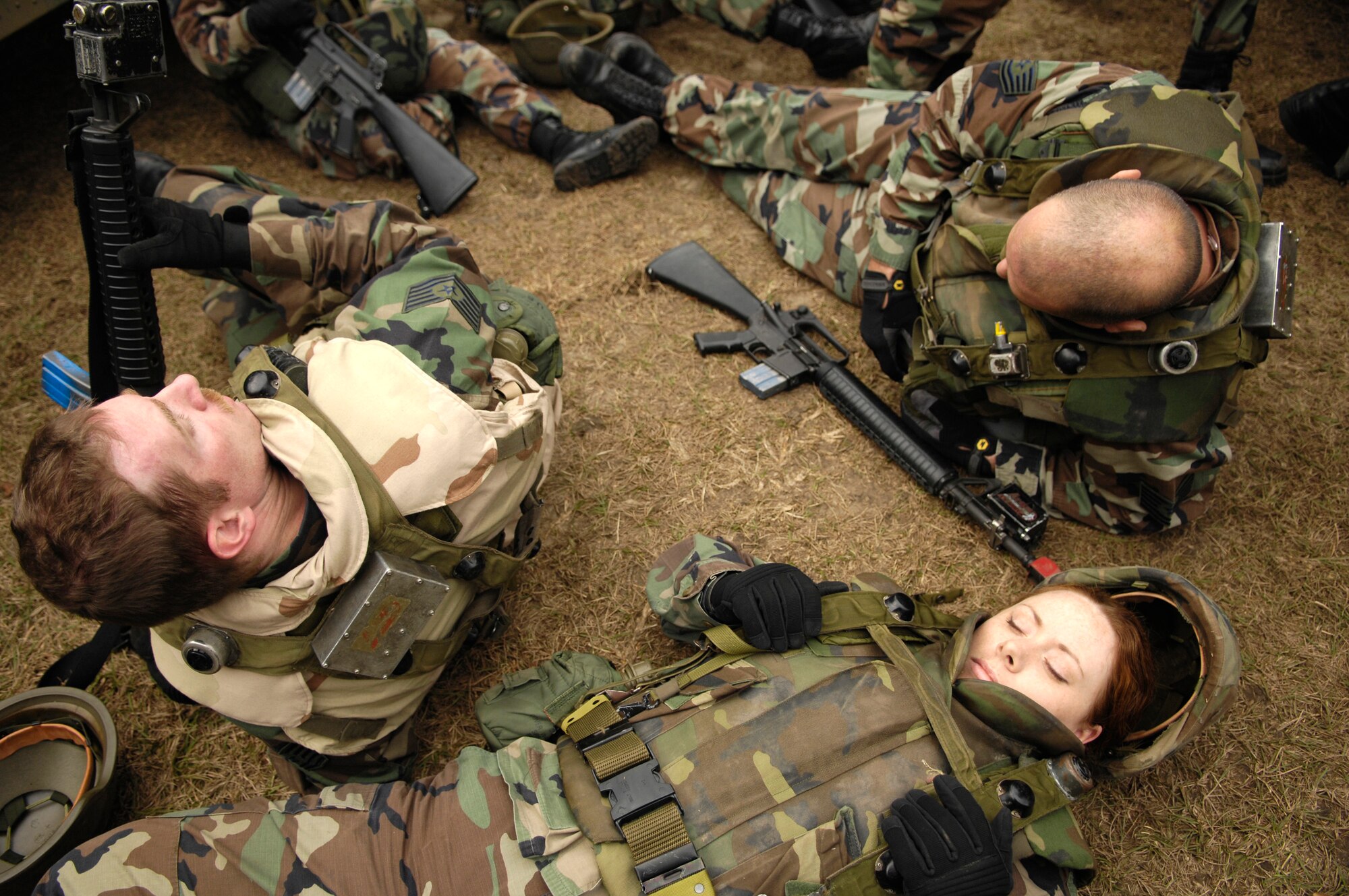 Members of the 437th Airlift Wing take a break in between scenarios during the Expeditionary Combat Skills Training Dec. 7 at Charleston Air Force Base, S.C. The ECST is a three-day tactical operations course to prepare Charleston Airmen for deployment. (U.S. Air Force photo/Senior Airman Desiree N. Palacios)
