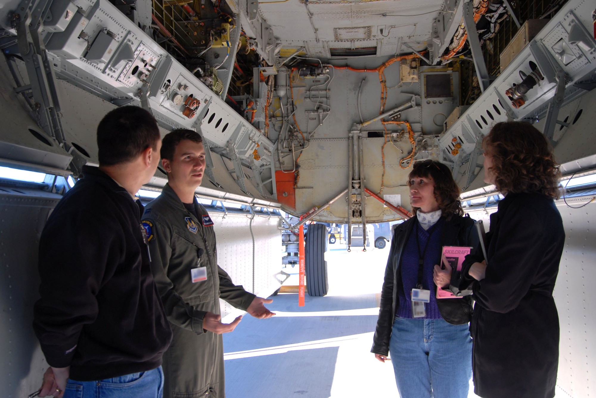 Capt. Miles Middleton shows equipment in the weapons bay of a B-52 Stratofortress to students from the University of Idaho. The students are studying advanced human factors, and familiarization with the bomber is part of a class project. Captain Middleton, a B-52 pilot, is the 419th Flight Test Squadron B-52H test project officer. (U.S. Air Force photo/Airman Stacy Sanchez)