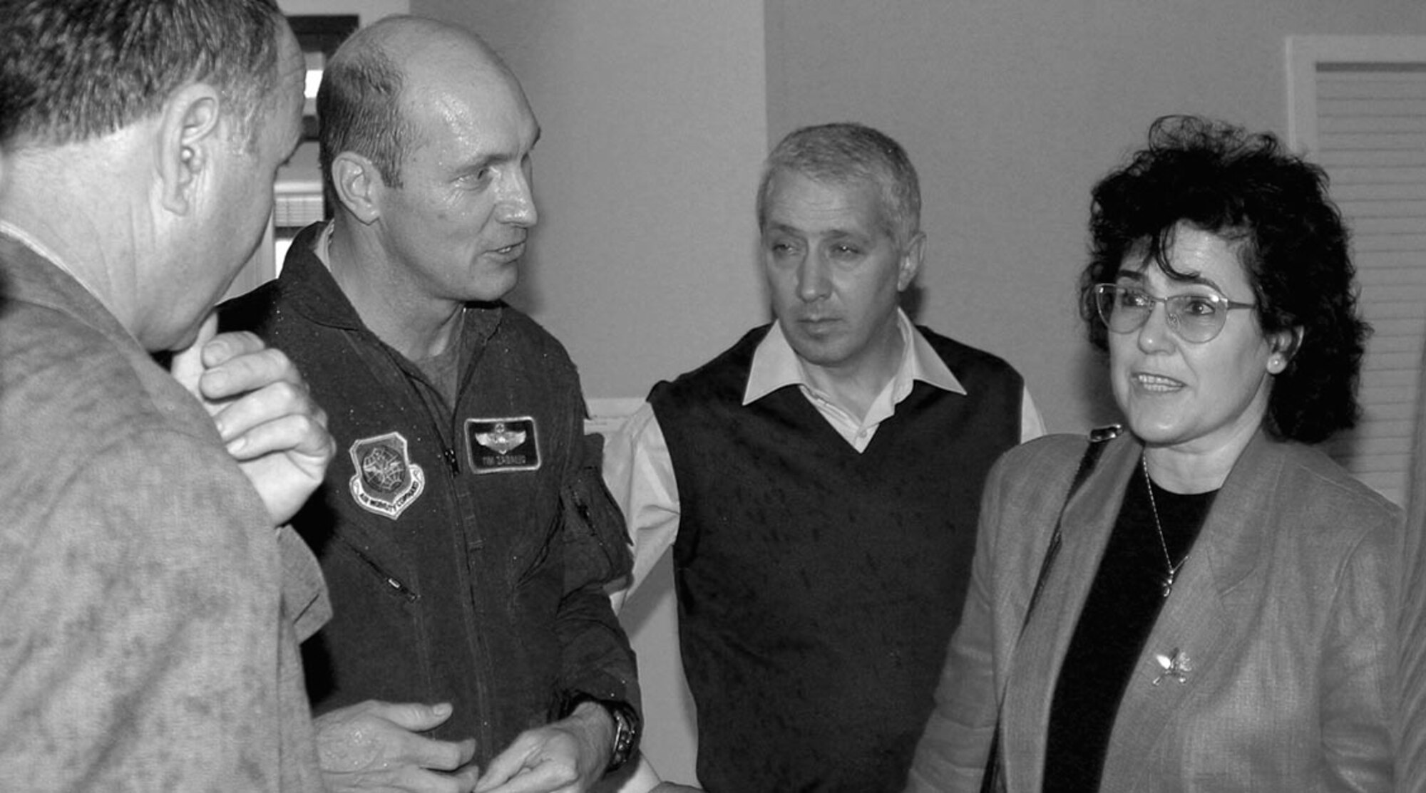 Col. Timothy Zadalis, 43rd Airlift Wing Commander, talks with Bulgarian mayors Dec. 1. Seven mayors and their translators visited Pope to learn more about the mission here. The stop at Pope was one of several stops throughout the country on the Bulgarian's itinerary.