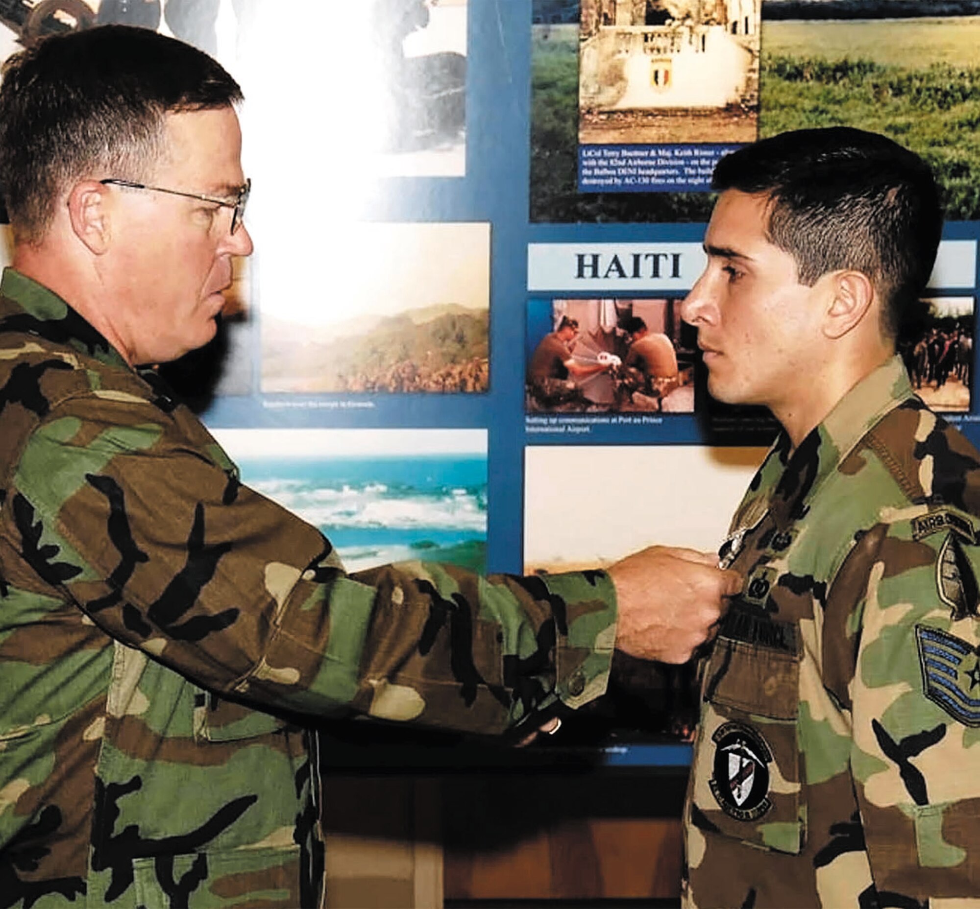 Brig. Gen. Blair E. Hansen, 9th Air Force Vice Commander, presents Tech. Sgt. Juan Valentin the Purple Heart in a ceremony at the 18th Air Support Opeations Group building Nov. 30. Sergeant Valentin was wounded in action in Afghanistan by an Improvised Explosive Device. The sergeant is with the 17th Air Support Operations Squadron. (U.S. Air Force photo by Mike Murchison)