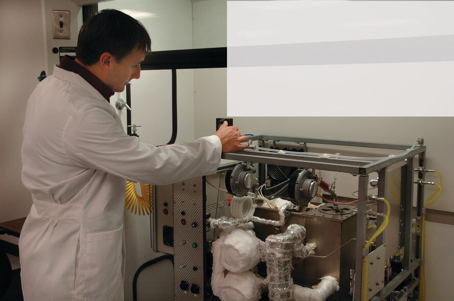 TYNDALL AIR FORCE BASE, Fla. --  Richard Trotta observes the settings of a generator that reforms jet fuel into a hydrogen-rich product. The hydrogen product is fed into a fuel cell to create electricity. (U.S. Air Force photo by 1st Lt. Amanda Ferrell)