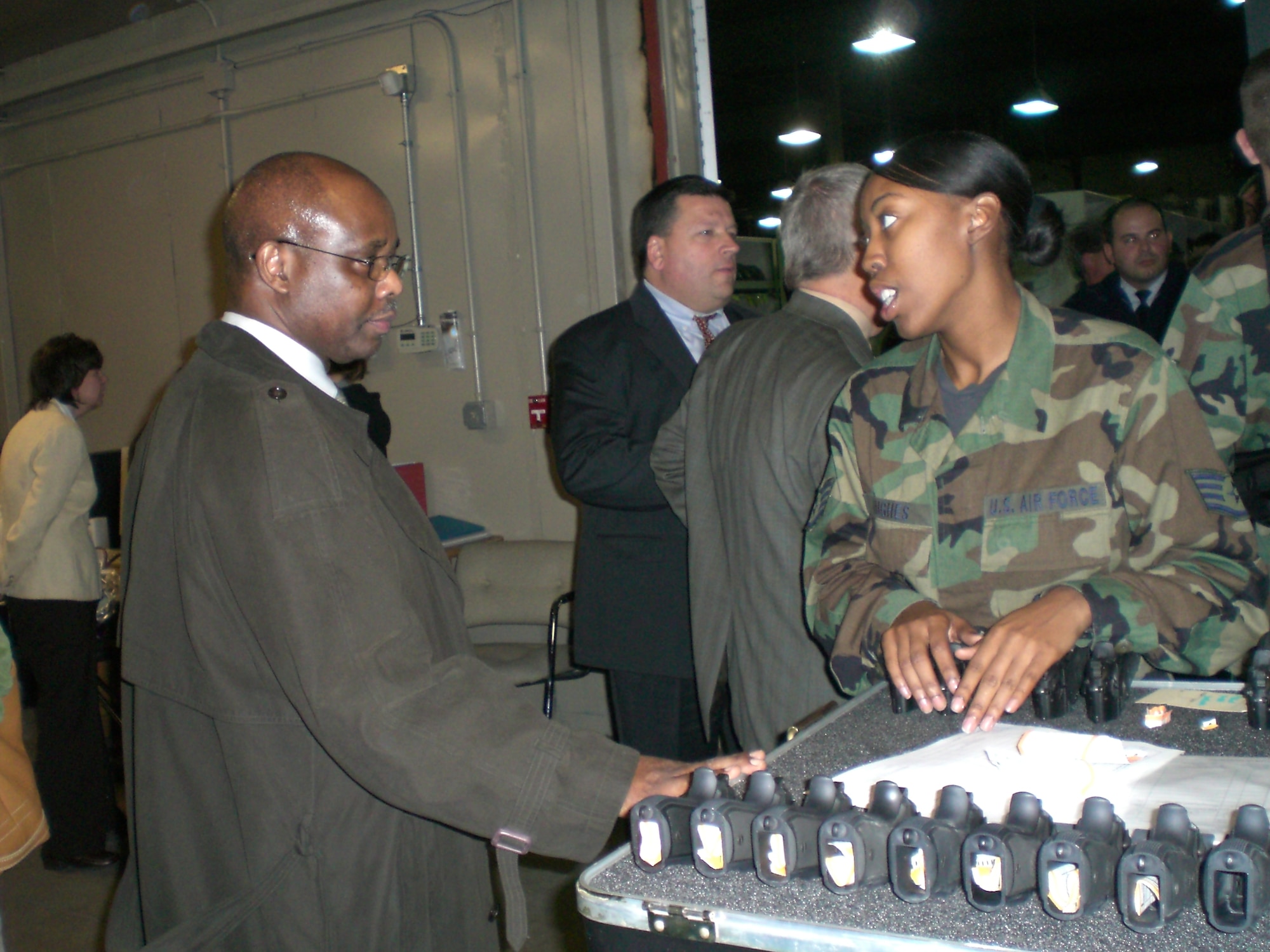 MCGUIRE AIR FORCE BASE, N.J. -- Staff Sgt. Alicia Hughes, 305th Logistics Readsiness Squadron war readiness craftsman, speaks to a CRT attendee about the variety of equipment Airmen are issued before they deploy. U.S. Air Force Photo by Senior Airman Dilia DeGrego