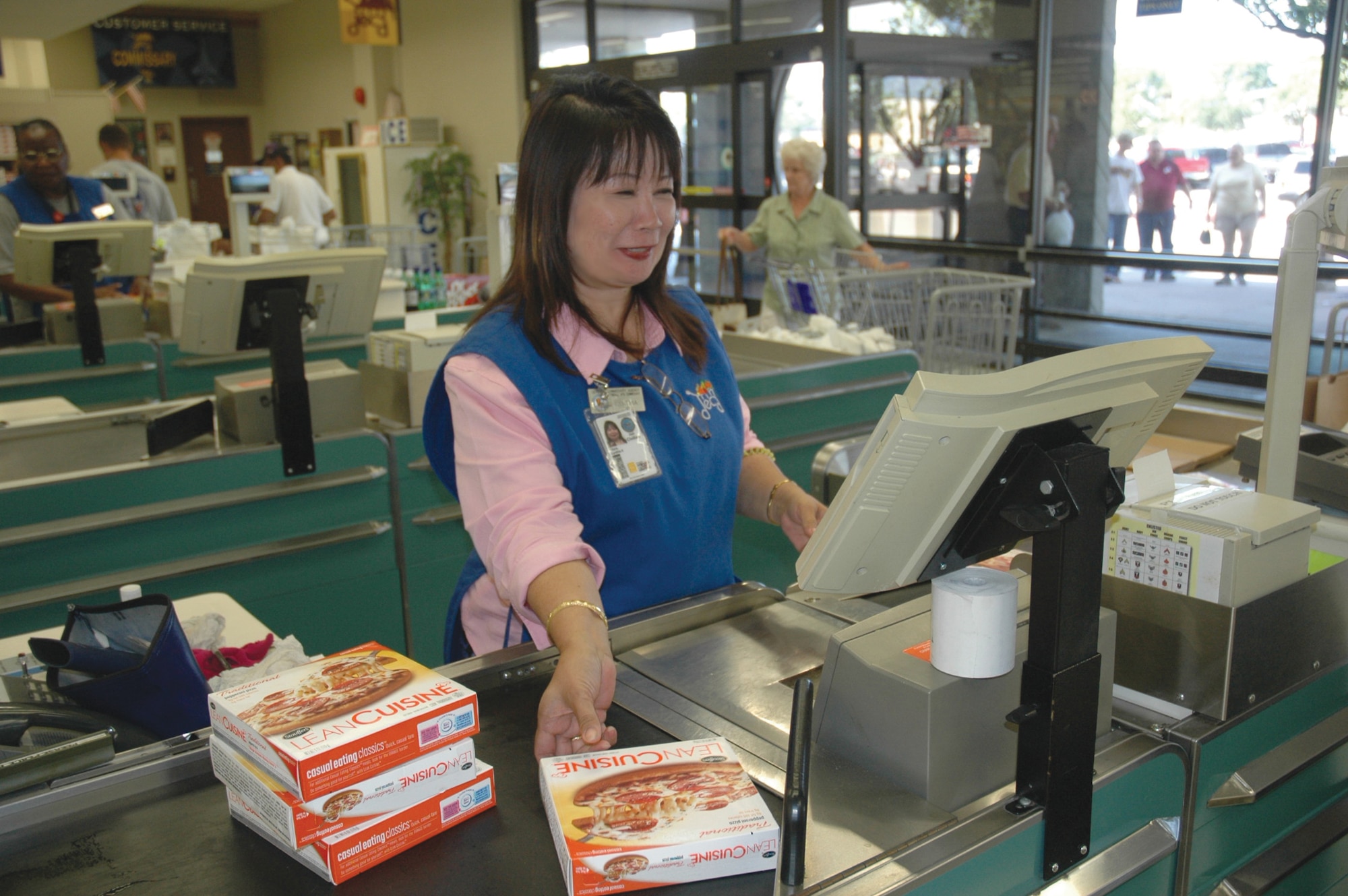 TYNDALL AIR FORCE BASE, Fla. --  Ms. Cynthia A. Nitura, cashier and 2006 Defense Commissary Agency Equal Employment Opportunity winner of the year, scans items at Tyndall's Commissary. She said she has enjoyed working for DECA for nearly 17 years, 10 of which have been at Tyndall. Outstanding customer service and community involvement were the criteria for winning the award. (U.S. Air Force photo by 1st Lt. Amanda Ferrell)