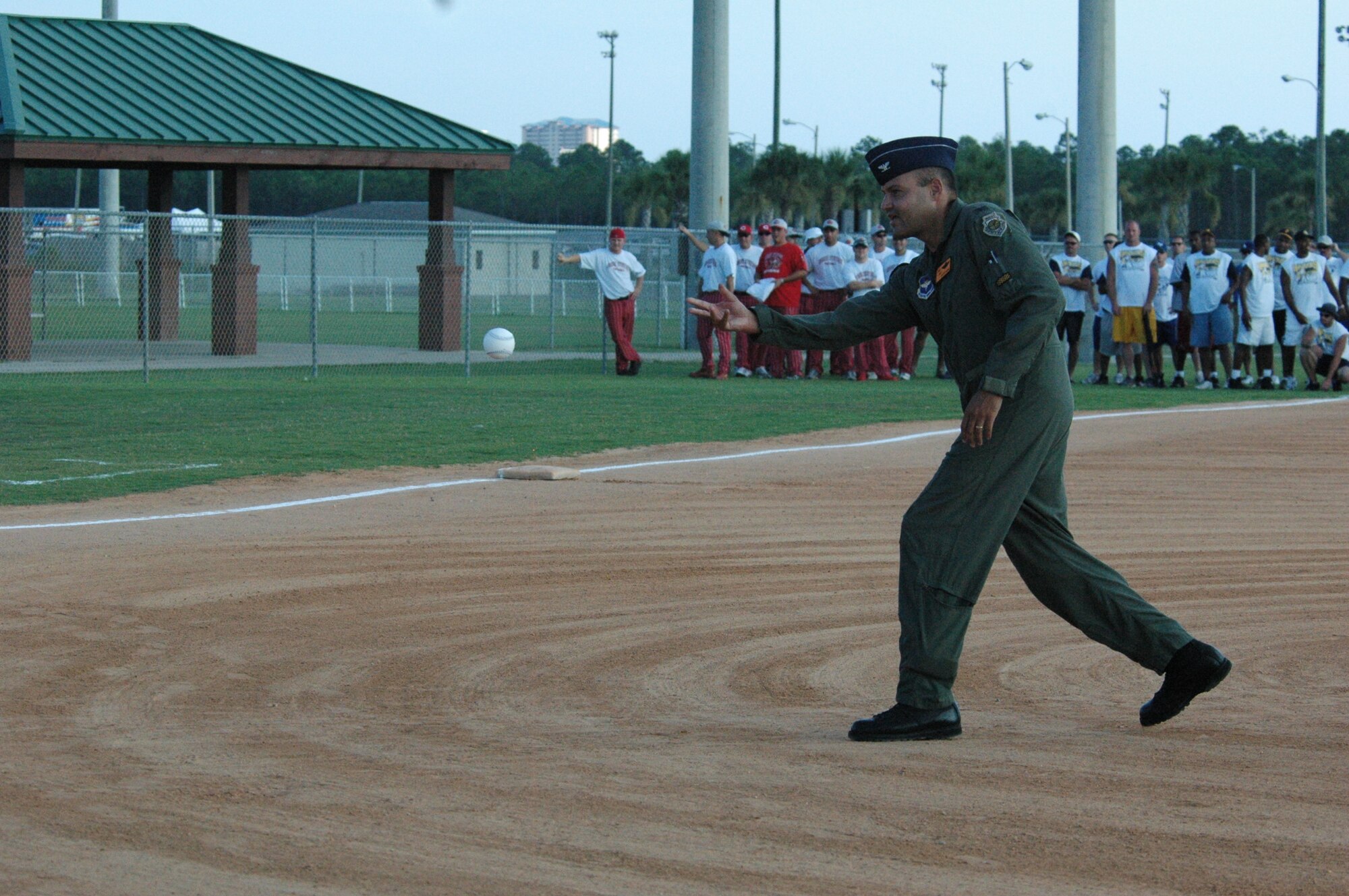 PANAMA CITY BEACH, Fla. --  Col. Scott Davis, 325th Fighter Wing vice commander, throws the first pitch at the U.S. Slow-pitch Softball Association Military World Championship here Aug. 18. Military teams from around the world competed in the three-day tournament, including three Tyndall teams. (U.S. Air Force photo by Chrissy Cuttita)