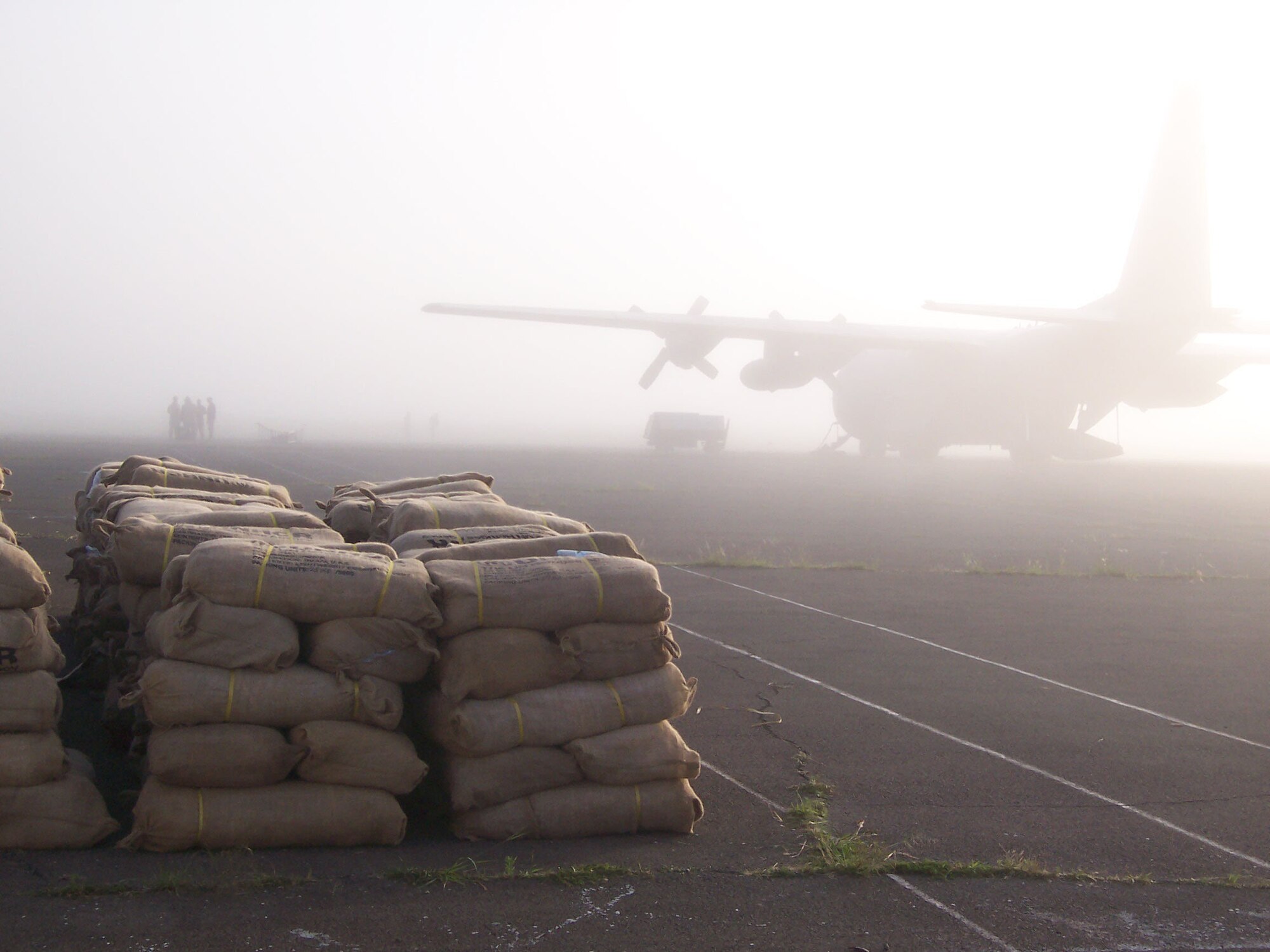 A C-130 Hercules assigned to the 379th Air Expeditionary Wing awaits relief supplies Dec. 9 destined to flood victims in Kenya. Aircrews from the 746th Expeditionary Airlift Squadron based in Southwest Asia are flying flood relief missions in support of Operation Unity Knight. (U.S. Air Force photo/Tech. Sgt. Steve Staedler)