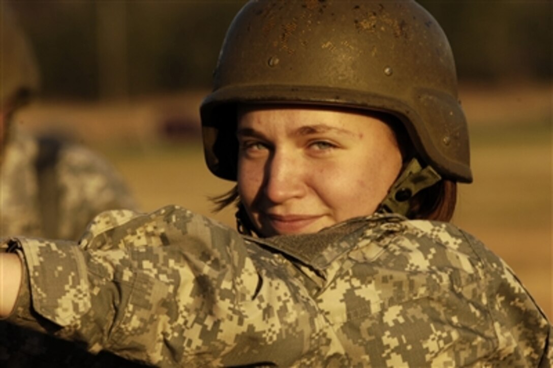A U.S. Army soldier from Company C, 262nd Quartermaster Battalion, poses for a picture prior to an airborne jump at Fort Lee, Va., Dec. 7, 2006. Soldiers of Company C, training to be parachute riggers, pack their own parachutes and jump as part of their advanced individual training requirements.