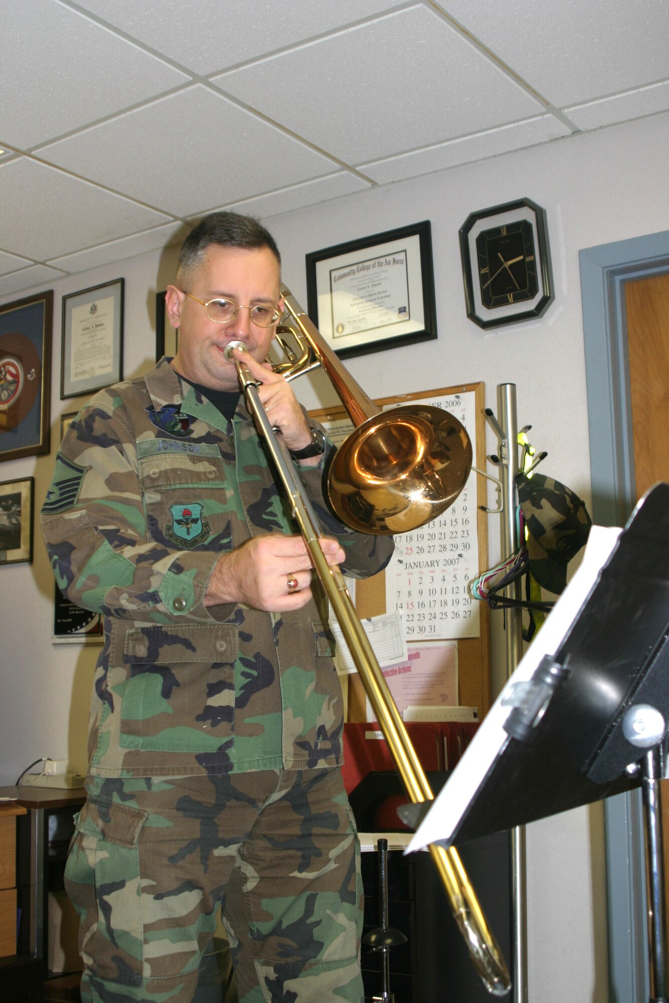 Master Sgt. Clayton "Buddy" Johnson, 314th Communications Squadron base equipment control officer, practices his music in his office. Sergeant Johnson has been practicing an hour before and after work to hone his chops for the Tops In Blue performance group.
Photo by Tech. Sgt. Arlo Taylor