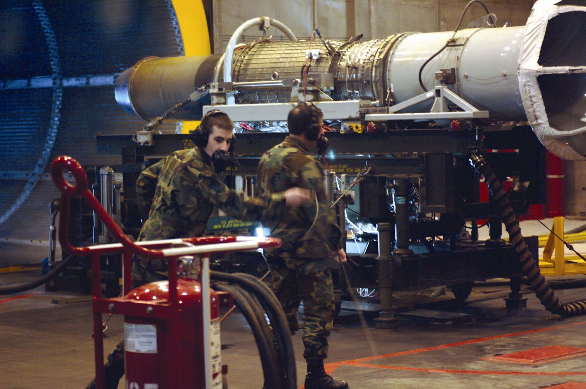Airman Nicholas Tanzillo, 49th Maintenance Squadron, demonstrates an engine run as Brig. Gen. David Goldfein, 49th Fighter Wing commander, watches on.