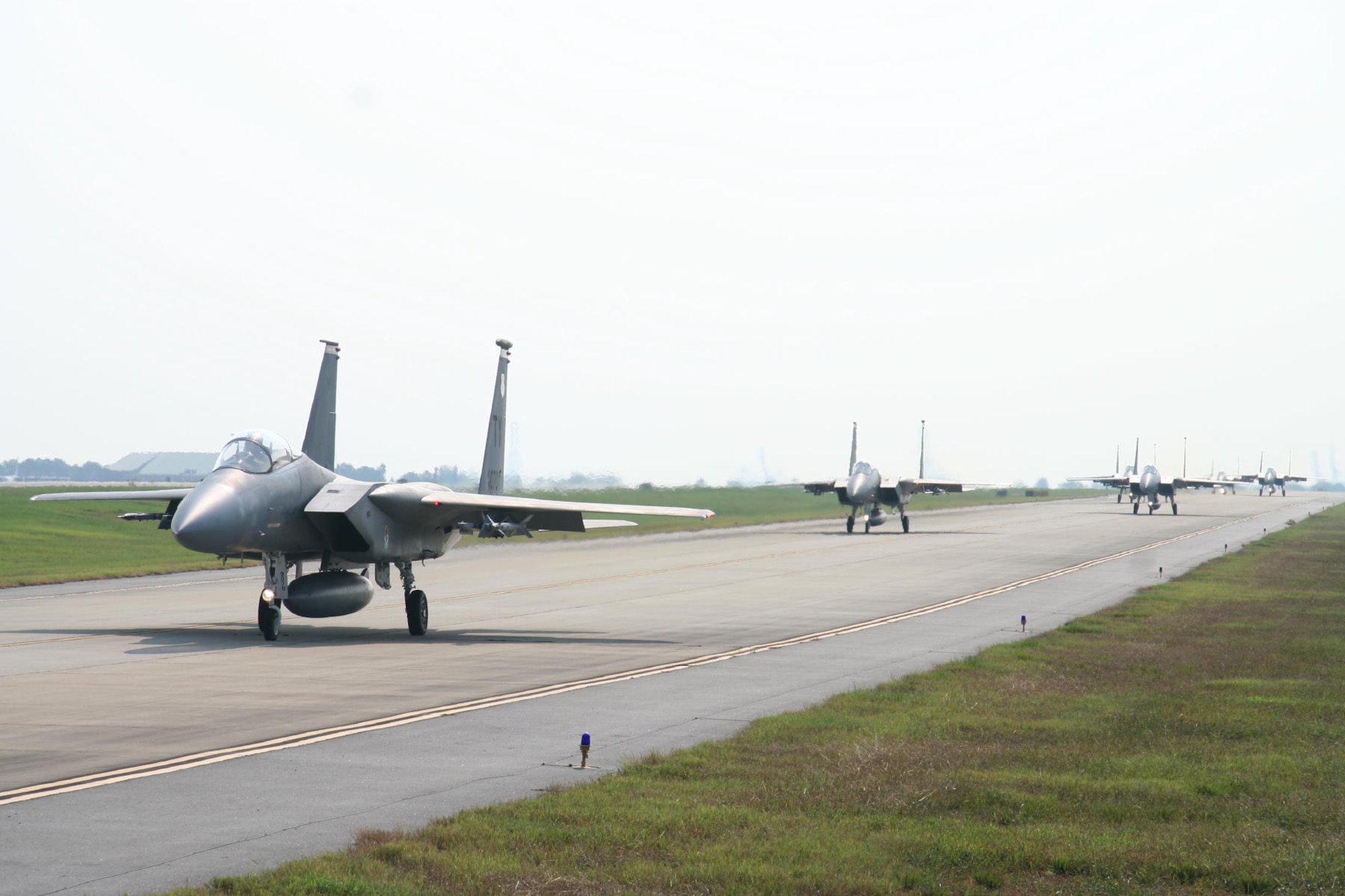 TYNDALL AIR FORCE BASE, Fla. --  Leading his eight-ship formation of F-15C Eagles from the 1st and 95th Fighter Squadrons, Lt. Col. Tom Menker, 1st Fighter Squadron commander, taxis to the runway for takeoff during a Large Force Employment mission against F-16 and F/A-18 aircraft. (U.S. Air Force photo by Maj. John York)