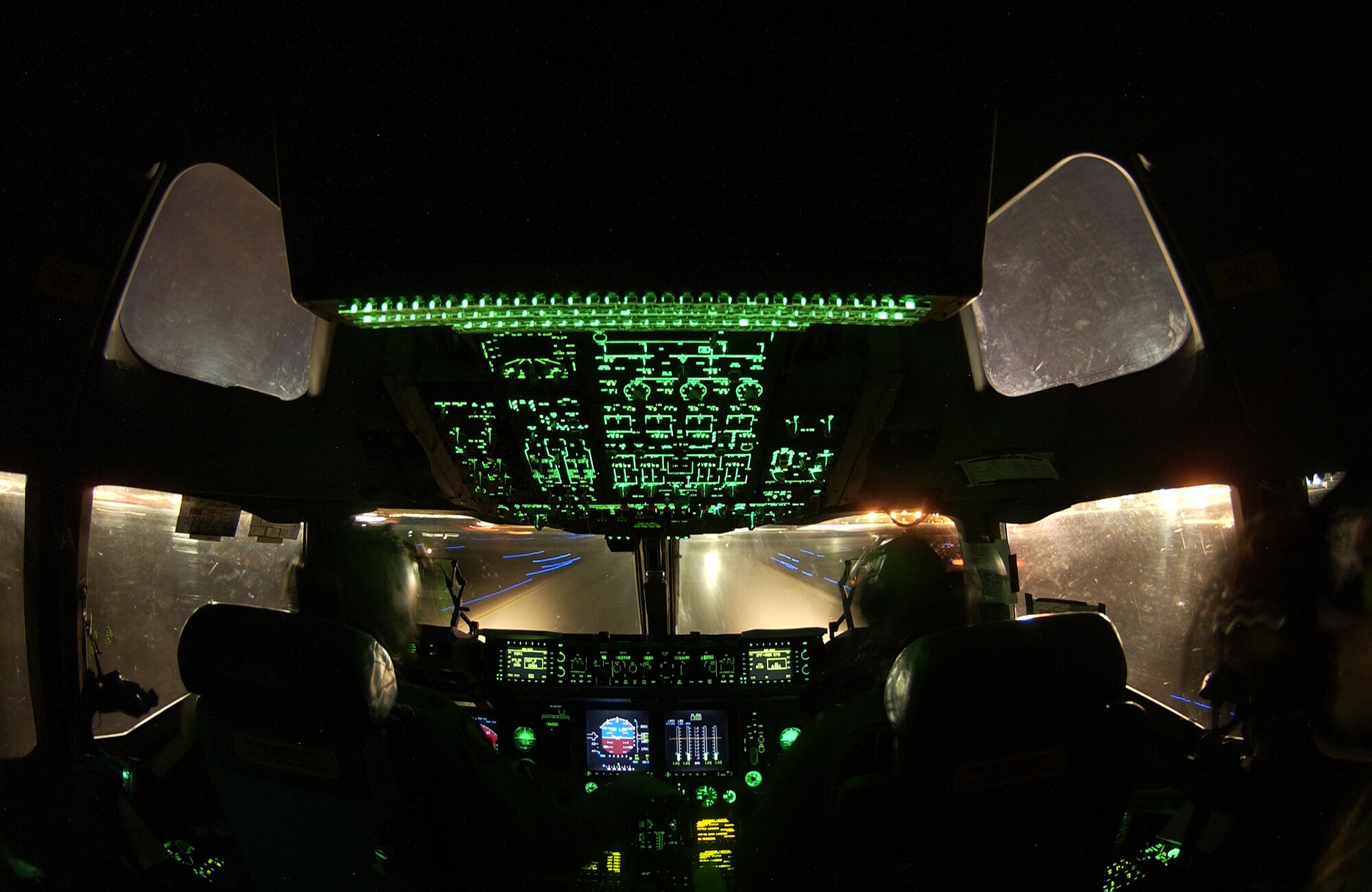 Capt. Tony Carr and Capt. Tim Garland, McGuire Air Force Base, N.J., approach the rotation point for lift-off in a C-17 Globe Master III Dec.11 at Nellis Air Force Base, Nev. during the U.S. Air Force Weapon School's Mission Employment Phase. Approximately 80 aircraft from both the Air Force and Navy are participating in the two-week exercise. ME Phase is the final stage of a five-and a- half month course which trains students to be weapons officers. It is the final event prior to Weapons School graduation. (U.S. Air Force photo/Master Sgt. Kevin J. Gruenwald)
        

