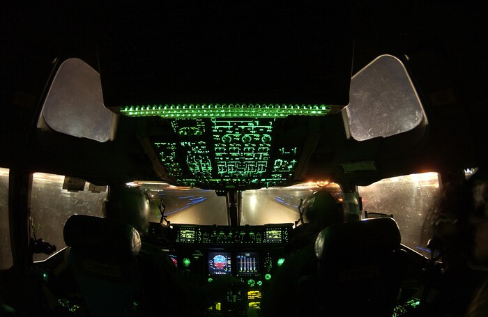 Capt. Tony Carr and Capt. Tim Garland, McGuire Air Force Base, N.J., approach the rotation point for lift-off in a C-17 Globe Master III Dec.11 at Nellis Air Force Base, Nev. during the U.S. Air Force Weapon School's Mission Employment Phase. Approximately 80 aircraft from both the Air Force and Navy are participating in the two-week exercise. ME Phase is the final stage of a five-and a- half month course which trains students to be weapons officers. It is the final event prior to Weapons School graduation. (U.S. Air Force photo/Master Sgt. Kevin J. Gruenwald)
        

