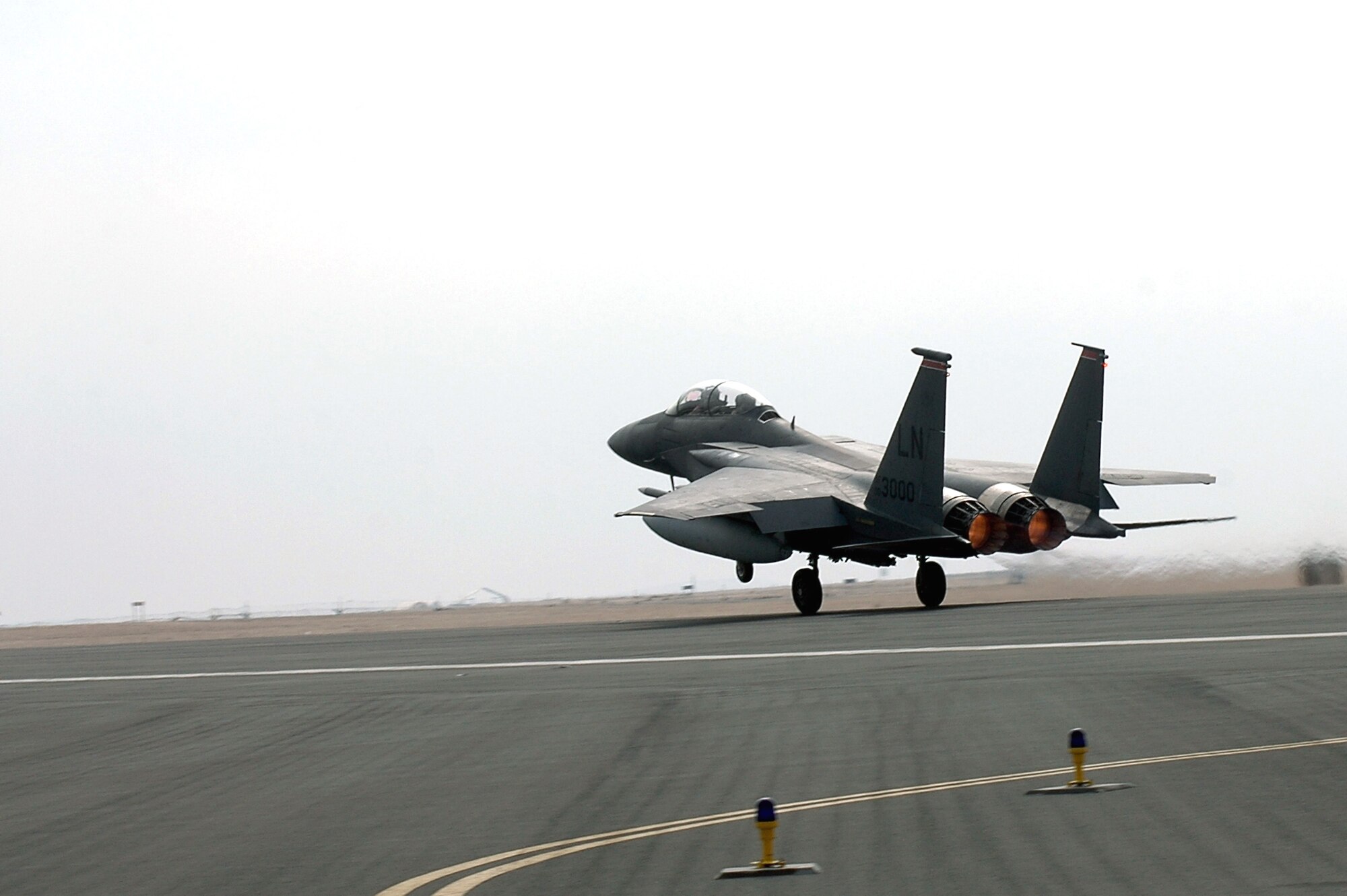 An F-15 Strike Eagle rolls down the runway on takeoff Dec. 11 in Southwest Asia. The F-15s are deployed to the 494th Expeditionary Fighter Squadron in support of Operation Iraqi Freedom. The 494th EFS was the first unit to fly the guided bomb unit 39/B small diameter bomb into combat in October. The new bomb, the first of its kind in the Air Force inventory, gives aircrews the ability to destroy targets that would normally be passed over due to the proximity of friendly troops, civilians, structures or personal property. (U.S. Air Force photo/Master Sgt. Shaun Withers)

