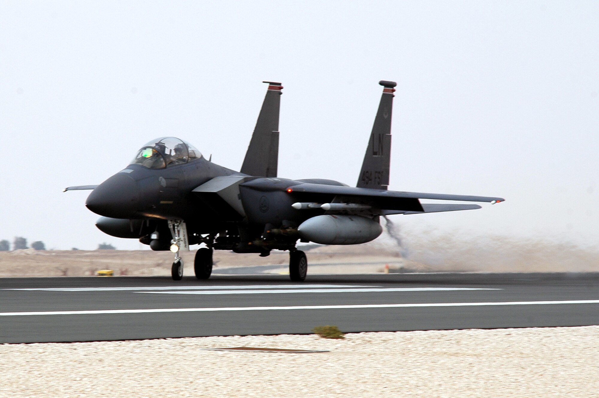 An F-15 Strike Eagle rolls down the runway on takeoff Dec. 11 in Southwest Asia. The F-15s are deployed to the 494th Expeditionary Fighter Squadron in support of Operation Iraqi Freedom. The 494th EFS was the first unit to fly the guided bomb unit 39/B small diameter bomb into combat in October. The new bomb, the first of its kind in the Air Force inventory, gives aircrews the ability to destroy targets that would normally be passed over due to the proximity of friendly troops, civilians, structures or personal property. (U.S. Air Force photo/Master Sgt. Shaun Withers) 
