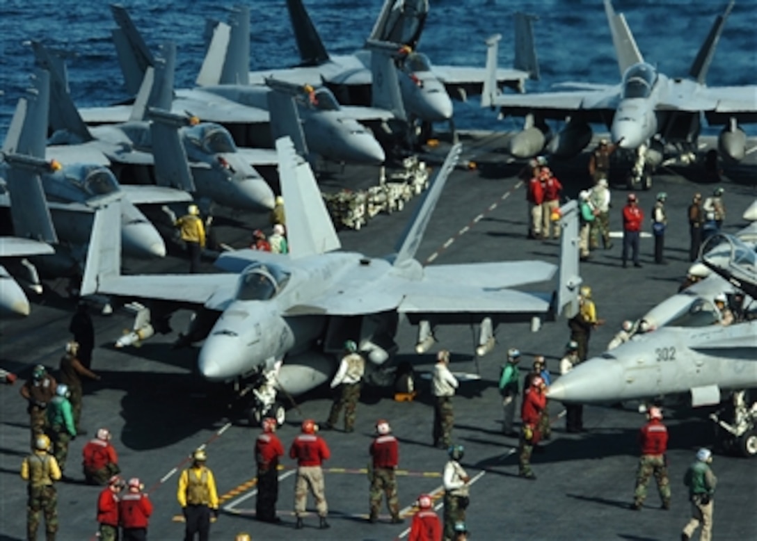 U.S. Navy sailors prepare for flight operations, Dec. 6, 2006, aboard the Nimitz-class aircraft carrier USS Dwight D. Eisenhower, which is on a regularly-scheduled deployment in support of maritime security operations in the Arabian Sea. 