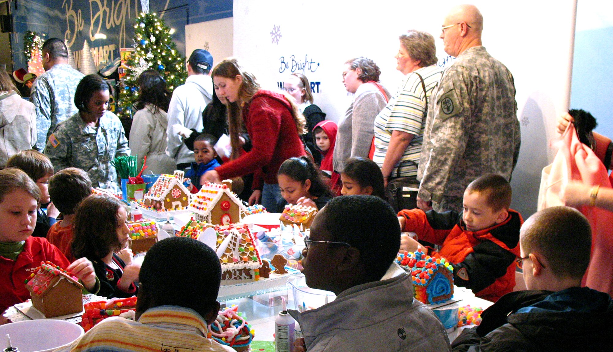 Military families build gingerbread houses during Operation Christmas Dec. 13 at the Texas National Guard Armory in San Antonio. Operation Christmas is an outreach program designed to show support to military families during the holiday season. (U.S. Air Force photo/Airman 1st Class Lana Mills) 