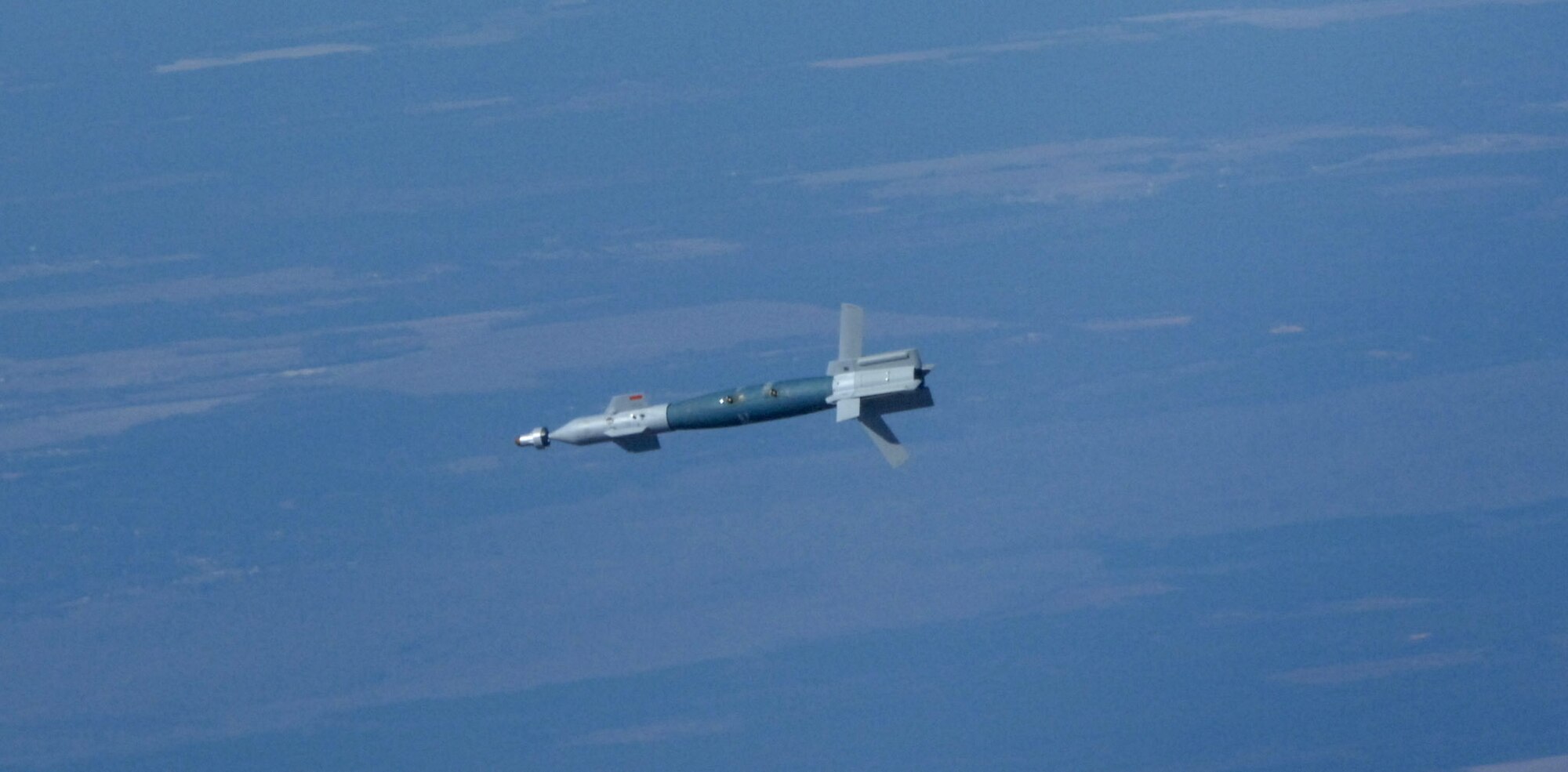 A laser-guided-bomb flies over the Bravo-70 range Dec. 5 at Eglin Air Force Base, Fla. The bomb was dropped by a CF-18 Hornet from the Canadian 409th Tactical Fighter Squadron.  The Canadians were taking part in the 86th Fighter Weapons Squadron's Weapons Systems Evaluation Program. (U.S. Air Force photo/ Lt. Col. Tim Pfeifer)
