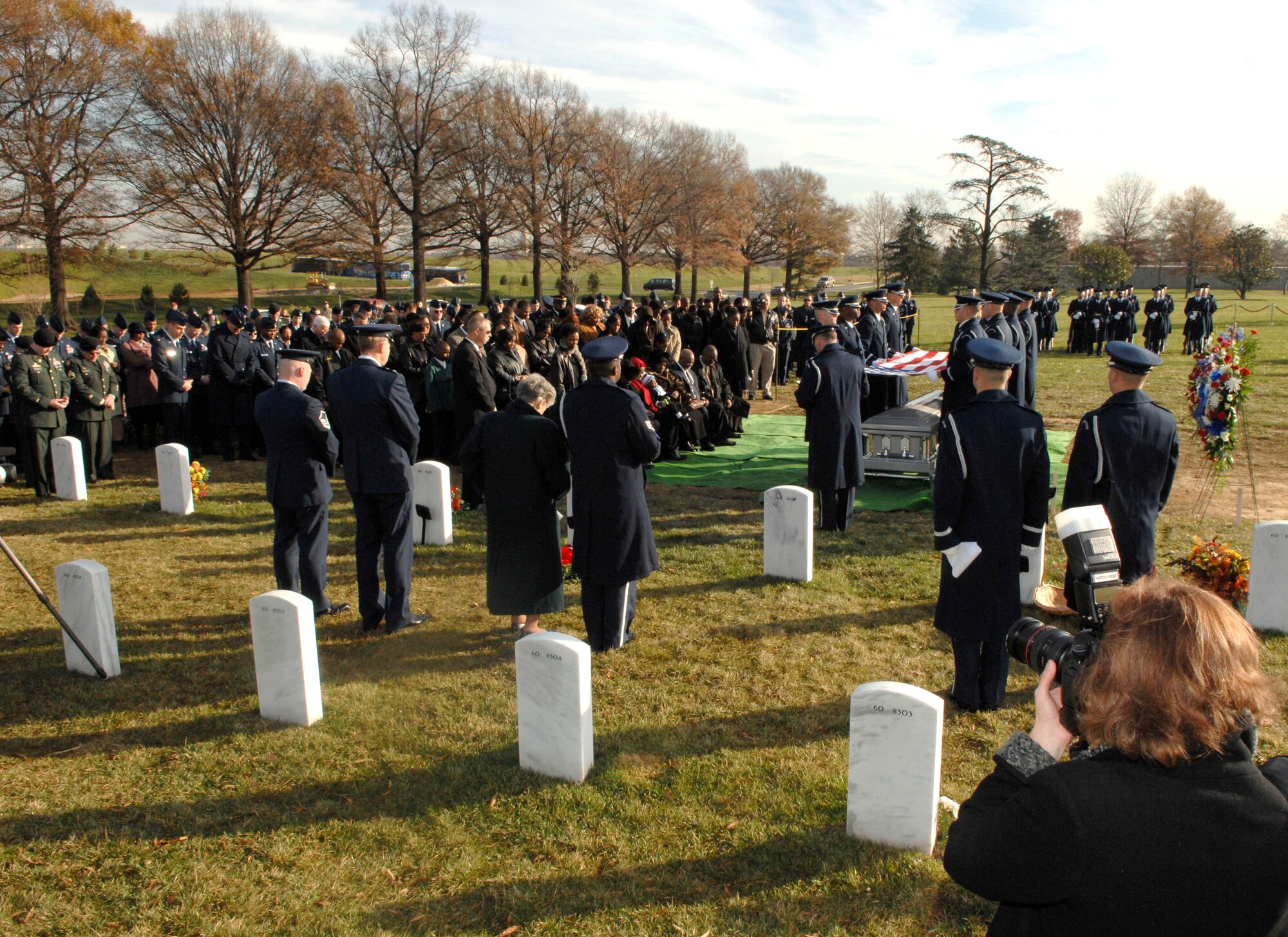 More than 200 friends and relatives gathered to pay their respects to Capt. Kermit Evans Dec. 12 at Arlington National Cemetery. Captain Evans was a member of the 27th Civil Engineering Squadron Explosives Ordnance Disposal Flight at Cannon Air Force Base, N.M. He was deployed to Iraq when the helicopter he was a passenger in made an emergency landing and crashed. He was one of the four out of 16 who were killed as a result of the crash. He is srvived by his wife, Perneatha, and Kermit Jr., their 13-month-old son.(U.S. Air Force photo/Tech. Sgt. Cohen Young) 