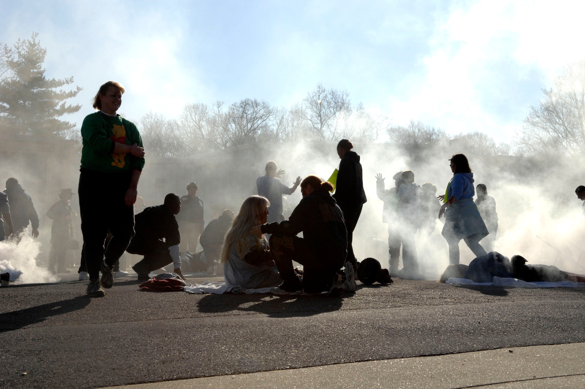 Chaos occurs as "victims" walk around after a simulated fuel explosion during the Collaborative Multi-Agency Medical Exercise, known as CMAX, that took place in the Washington D.C. area on Dec. 7.  The annual exercise was designed to test the capabilities of the local authorities to handle a major catastrophe. This was the first year that patient transport was included in the exercise.  (U.S. Air Force photo/Tech. Sgt. Cohen Young)