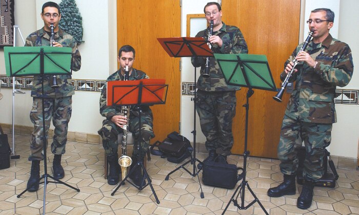 The clarinet quartet of the Air Force Band of the Golden West plays Christmas tunes at Nellis Air  Force Base, Nev., Dec. 12. From left are Staff Sgt. Igor Poklad, Senior Airman Greg Gallant, Technical Sgt. Kevin Conners, and Technical Sgt. Frank Milicia. The four musicians, stationed at Travis Air Force Base, Calif., spent the day spreading holiday cheer at the Mike O’Callaghan Federal Hospital, Base Exchange, Commissary, Lomie Heard Elementary School and several work centers. (U.S. Air Force photo/Staff Sgt. Jeremy Smith)
