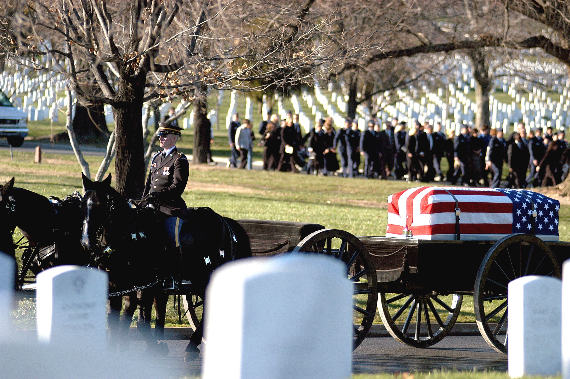 Members of the Caisson Platoon of the 3rd U.S. Infantry, The Old Guard carry Maj. Troy Gilbert to his gravesite Dec. 11 at Arlington Cemetery. Major Gilbert was the pilot of an Air Force F-16 Fighting Falcon engaged in support of coalition ground combat operations that crashed approximately 20 miles northwest of Baghdad Nov. 27. Major Gilbert was assigned to the 309th Fighter Squadron, Luke Air Force Base, Ariz., and was deployed to the 332nd Expeditionary Wing, Balad Air Base, Iraq. (U.S. Air Force photo)