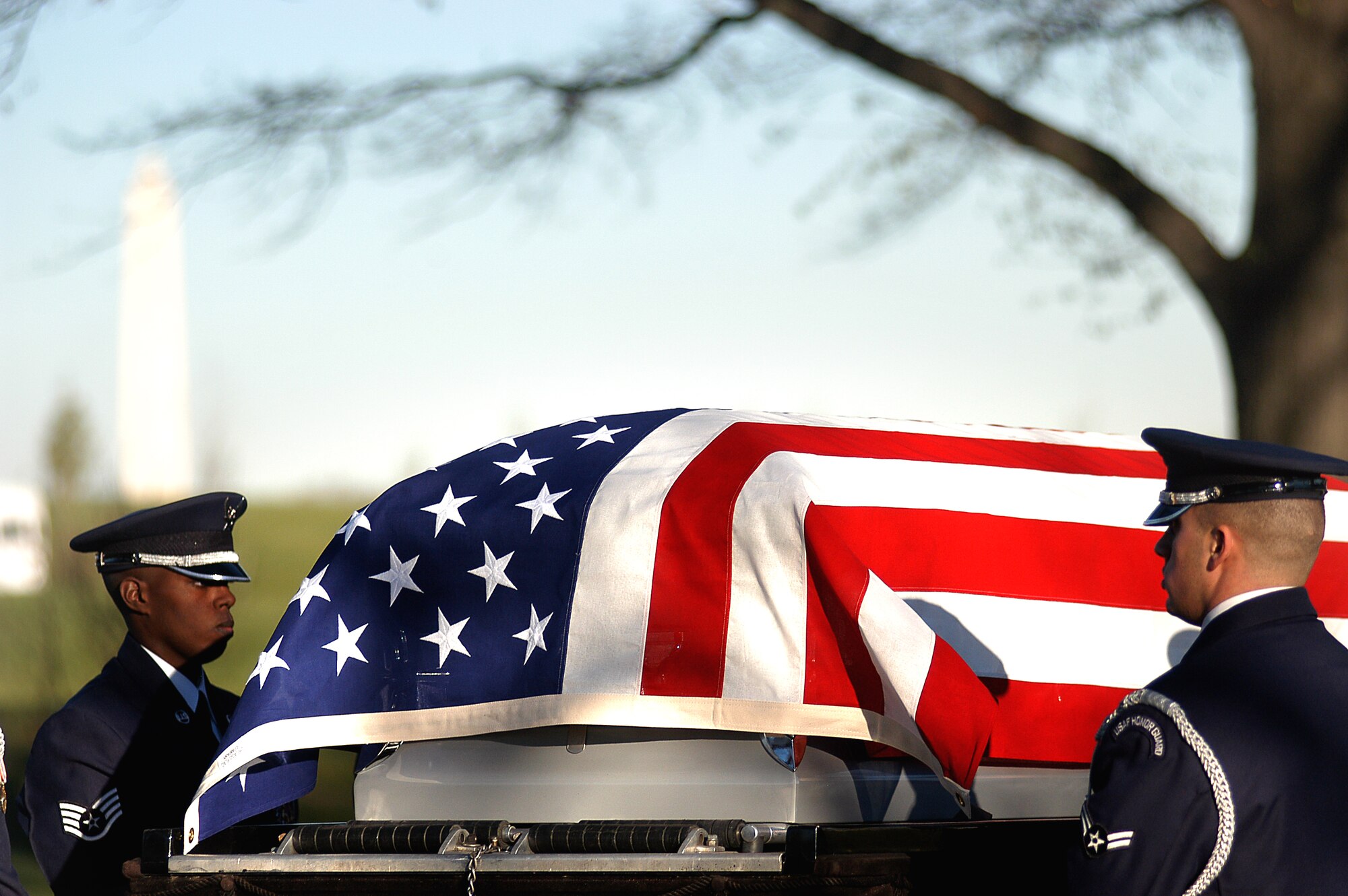 Air Force Honor Guard members prepare to carry Maj. Troy Gilbert's casket during a full honors funeral Dec. 11 at Arlington National Cemetery.  Major Gilbert was the pilot of an Air Force F-16 Fighting Falcon engaged in support of coalition ground combat operations that crashed approximately 20 miles northwest of Baghdad Nov. 27. Major Gilbert was assigned to the 309th Fighter Squadron, Luke Air Force Base, Ariz., and was deployed to the 332nd ExpeditionaryWing, Balad Air Base, Iraq. (U.S. Air Force photo/Maj. Francisco G. Hamm)