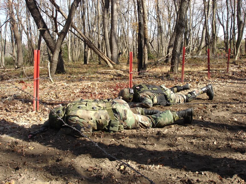 FORT DIX, N.J. -- Air Force students attending Contingency Skills Training make their way through a field training exercise here Nov. 14, 2006.  Each of the students attending the CST in November will deploy to locations within the U.S. Central Command Area of Responsibility sometime during the next year.