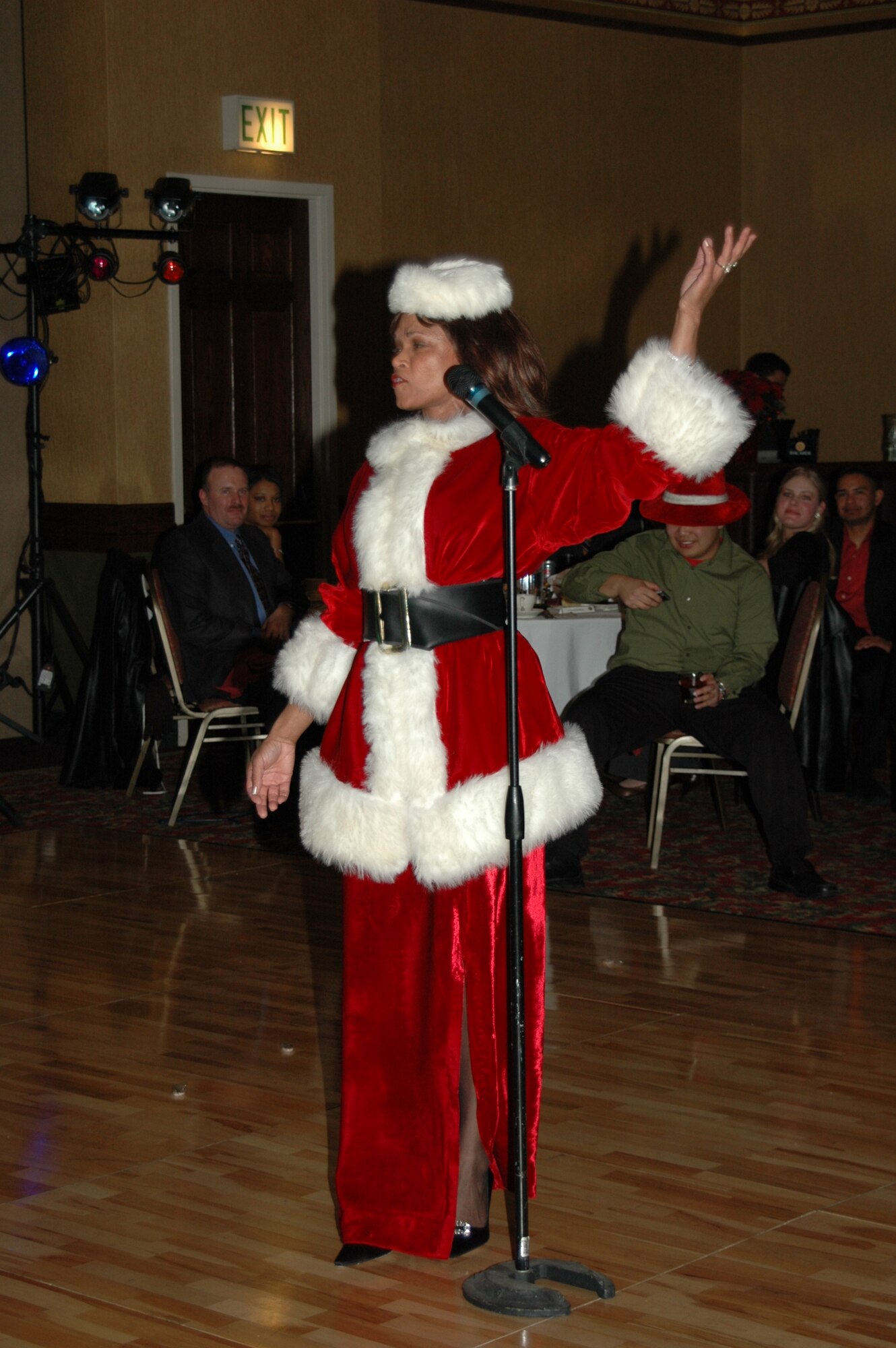 More than 460 Airmen here celebrated the season Dec. 1, at the Wing Holiday Party held in the Rushmore Plaza Holiday Inn. The gathering included a performance by the Rapid City Children’s Choir, a slideshow of deployed Ellsworth members, a plated meal, and dancing. Civic leaders attended, as well as Ellsworth civilians, servicemembers of all ranks, and their guests. To decrease the cost of the event, base personnel donated funds to see wing leaders dress in themed attire. Winners of the Santa and elves competition performed for the crowd in costume. 