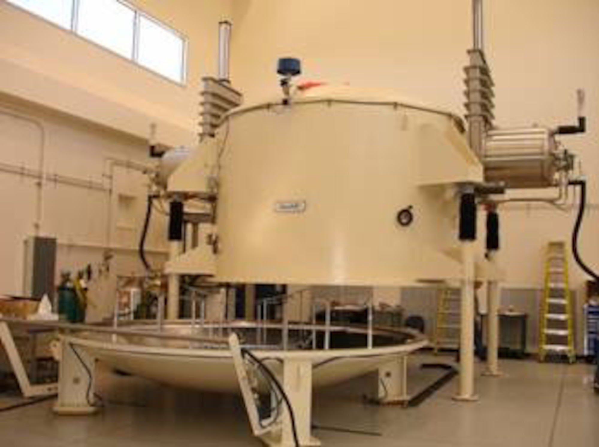 The Defense Department’s largest mirror coating chamber, open at center, was installed recently at the Air Force Research Laboratory’s Starfire Optical Range. (Air Force photo by 1st Lt. Wellington Phillips)