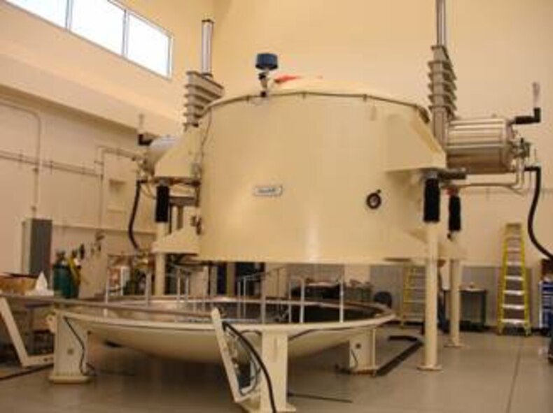 The Defense Department’s largest mirror coating chamber, open at center, was installed recently at the Air Force Research Laboratory’s Starfire Optical Range. (Air Force photo by 1st Lt. Wellington Phillips)