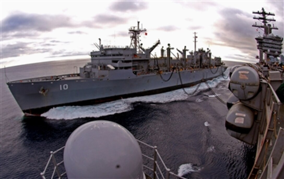 The Military Sealift Command fast combat support ship USNS Bridge performs a replenishment at sea with the nuclear-powered aircraft carrier USS Nimitz, Dec. 9, 2006. Nimitz is currently underway conducting Composite Training Unit Exercise off the coast of Southern California.
