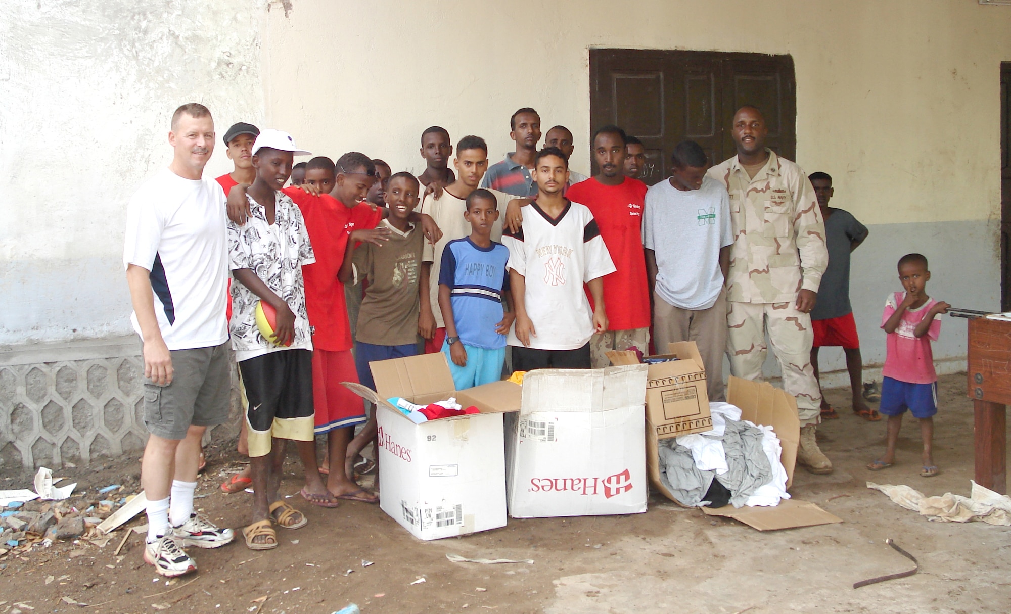 Chief Master Sgt. William Welch, deployed from 336th Training Group, and RP2 Greg Bennett, chaplain assistant, work with an all boys-orphanage in Djibouti, Africa. Chief Welch coordinated a drive to send clothing and supplies from Fairchild to the orphanage.