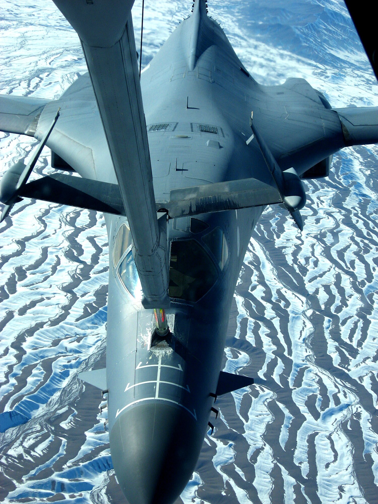 A B-1B Lancer receives fuel from a KC-10 Extender flying over Afghanistan Dec. 14. The tanker is from the 380th Air Expeditionary Wing, home of the largest air refueling wing in Southwest Asia.  Unit aircrews fly KC-10s and KC-135 Stratotankers in support of wartime operations. (U.S. Air Force photo/Capt. Justin T. Watson)