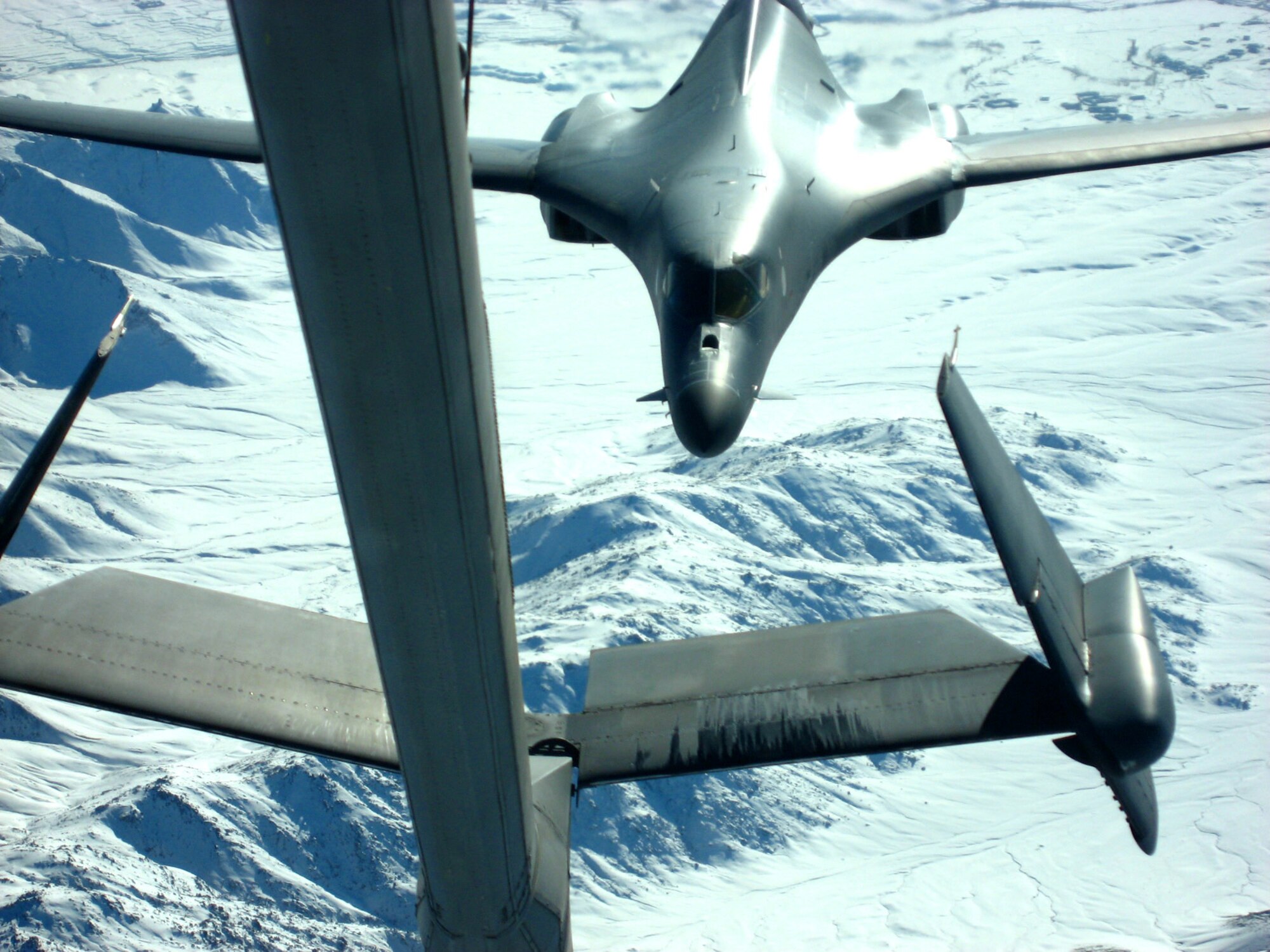 A B-1B Lancer needing fuel pulls up behind a KC-10 Extender flying over Afghanistan Dec. 14. The tanker is from the 380th Air Expeditionary Wing, home of the largest air refueling wing in Southwest Asia.  Unit aircrews fly KC-10s and KC-135 Stratotankers in support of wartime operations. (U.S. Air Force photo/Capt. Justin T. Watson)