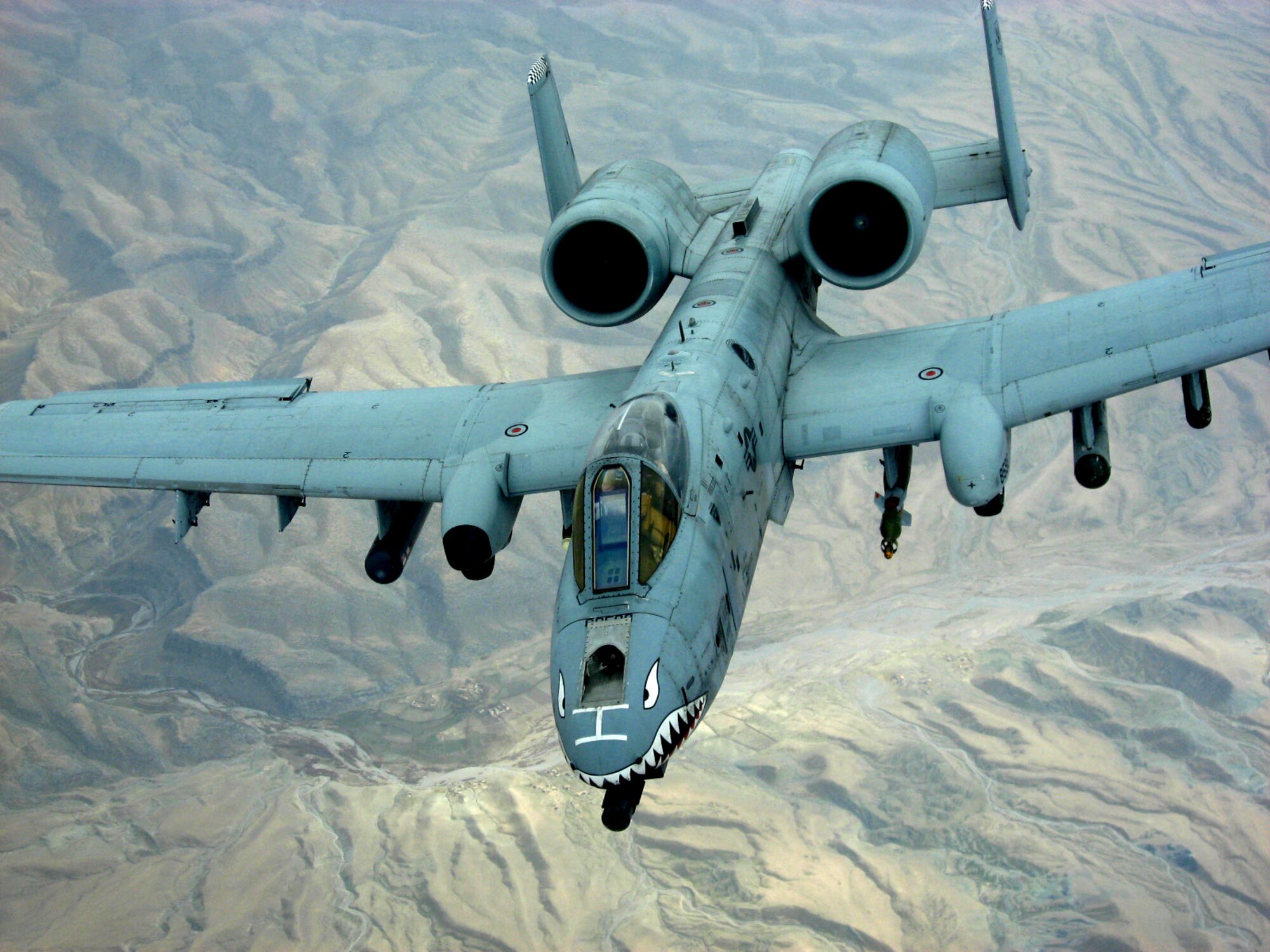 An A-10 Thunderbolt II pulls away after receiving fuel from a KC-10 Extender flying over Afghanistan Dec. 14. The tanker is from the 380th Air Expeditionary Wing, home of the largest air refueling wing in Southwest Asia.  Unit aircrews fly KC-10s and KC-135 Stratotankers in support of wartime operations. (U.S. Air Force photo/Capt. Justin T. Watson)