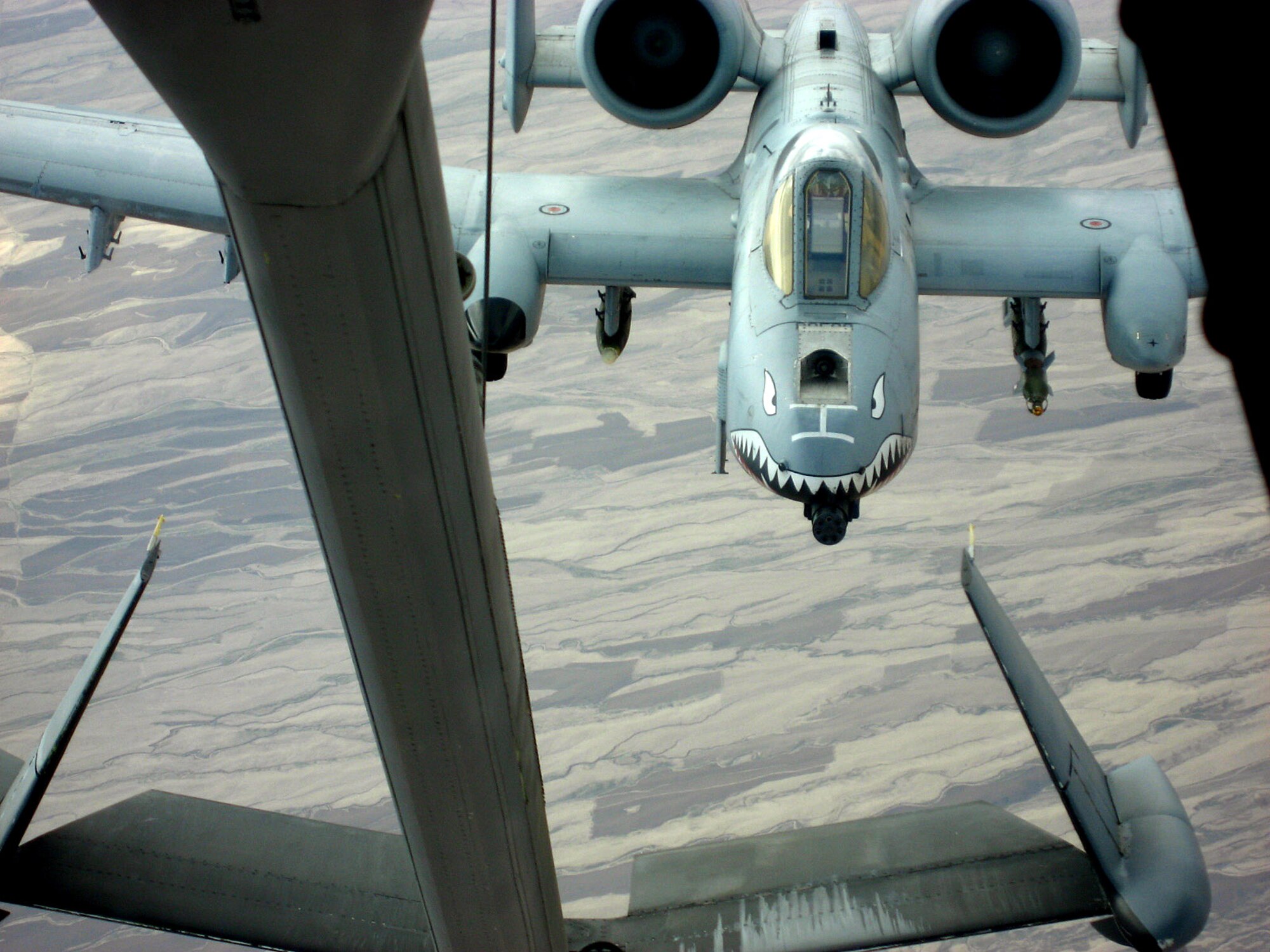 An A-10 Thunderbolt II needing fuel pulls up behind a KC-10 Extender flying over Afghanistan Dec. 14. The tanker is from the 380th Air Expeditionary Wing, home of the largest air refueling wing in Southwest Asia.  Unit aircrews fly KC-10s and KC-135 Stratotankers in support of wartime operations. (U.S. Air Force photo/Capt. Justin T. Watson)