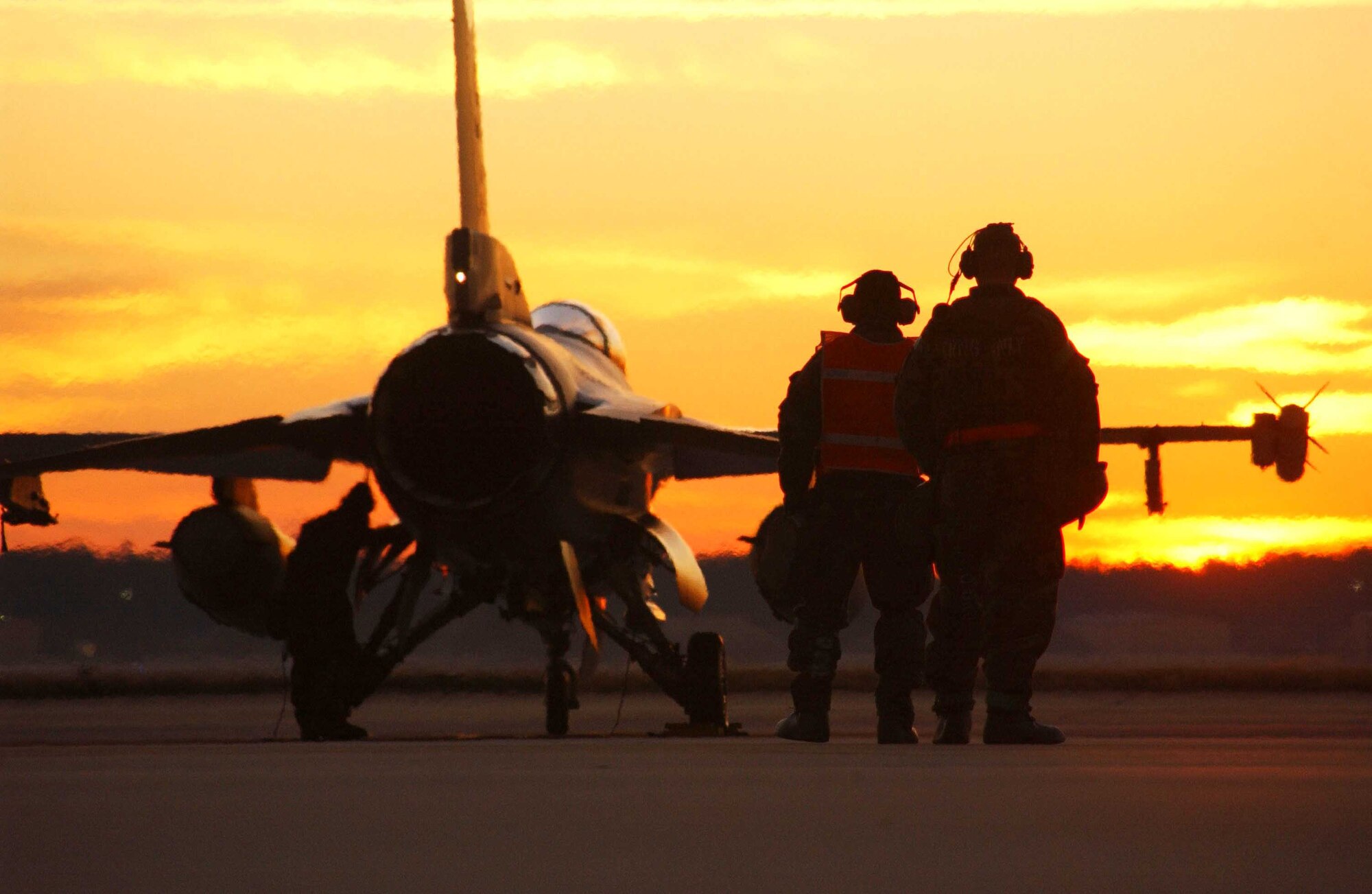 SHAW AIR FORCE BASE, S.C. -- Master Sgt. Tracey Shook (left) and Tech. Sgt. Aubrey Dickerson, both of the 77th Aircraft Maintenance Unit,  watch an F-16 Fighting Falcon launch Dec. 6 during the operational readiness exercise, Sea Lion 07-02. The exercise tested Airmen's ability to operate in a deployed location. (U.S. Air Force photo/Staff Sgt. Nathan Bevier)