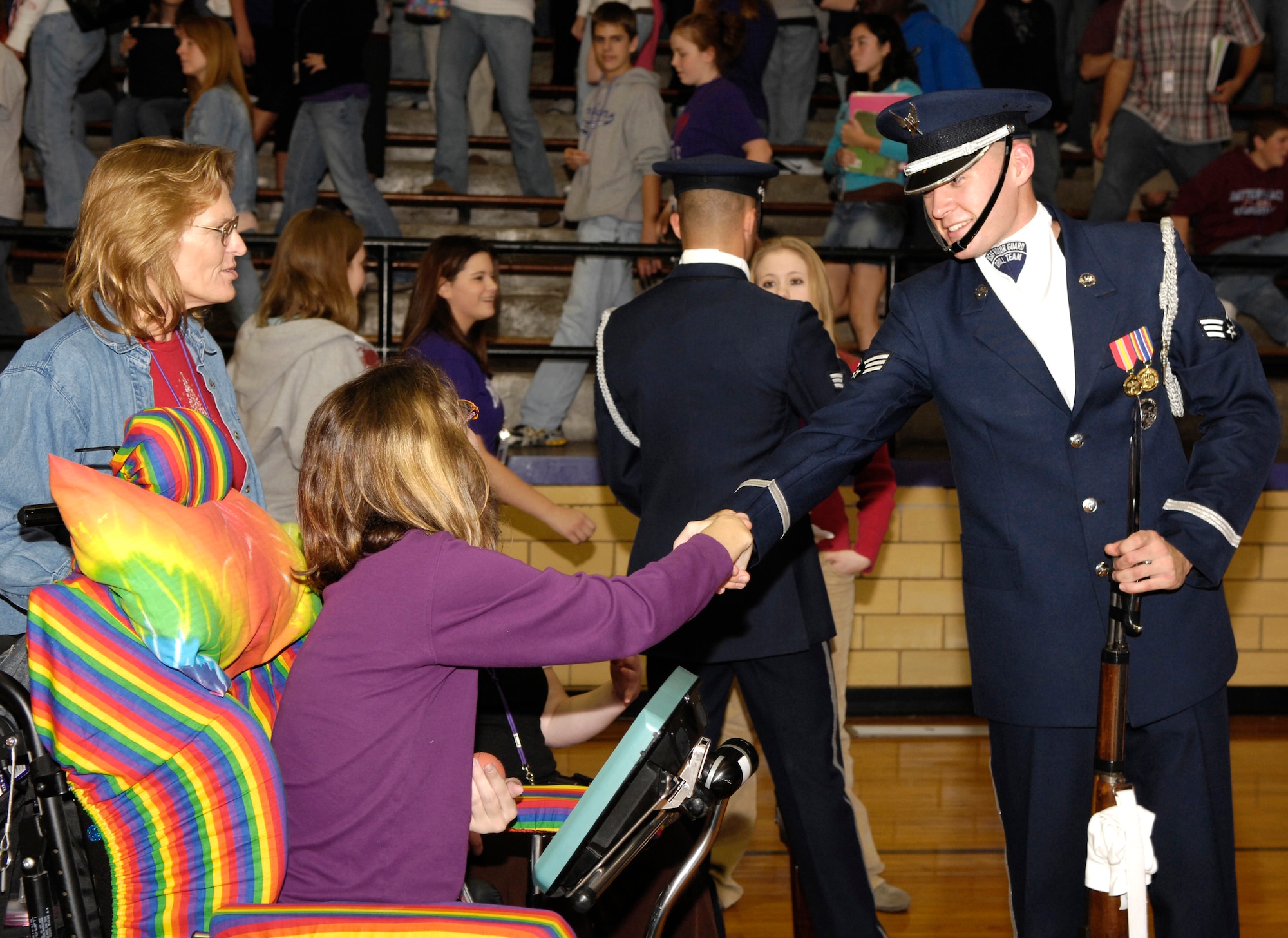 Senior Airman Jason Martin speaks with students Dec. 12 at Mascoutah High School in Mascoutah, Ill.  He is a member of the U.S. Air Force Honor Guard Drill Team. The Drill Team travels stateside and abroad performing drills for public and military audiences to recruit and inspire current and future Airmen. (U.S. Air Force photo/Airman 1st Class Marleah Miller)