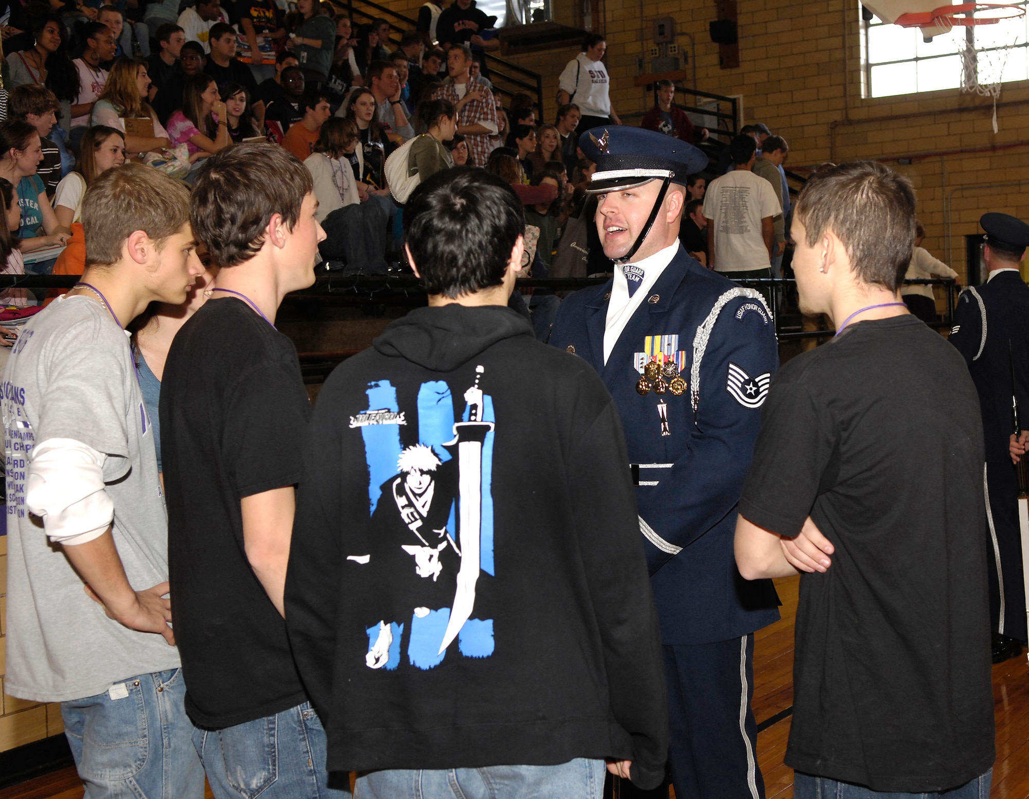 U.S. Air Force Honor Guard Drill Team commander Tech. Sgt. Toby Farr speaks to students Dec. 12 at Mascoutah High School in Mascoutah, Ill. The Drill Team travels stateside and abroad performing drills for public and military audiences to recruit and inspire current and future Airmen.  (U.S. Air Force photo/Airman 1st Class Marleah Miller)