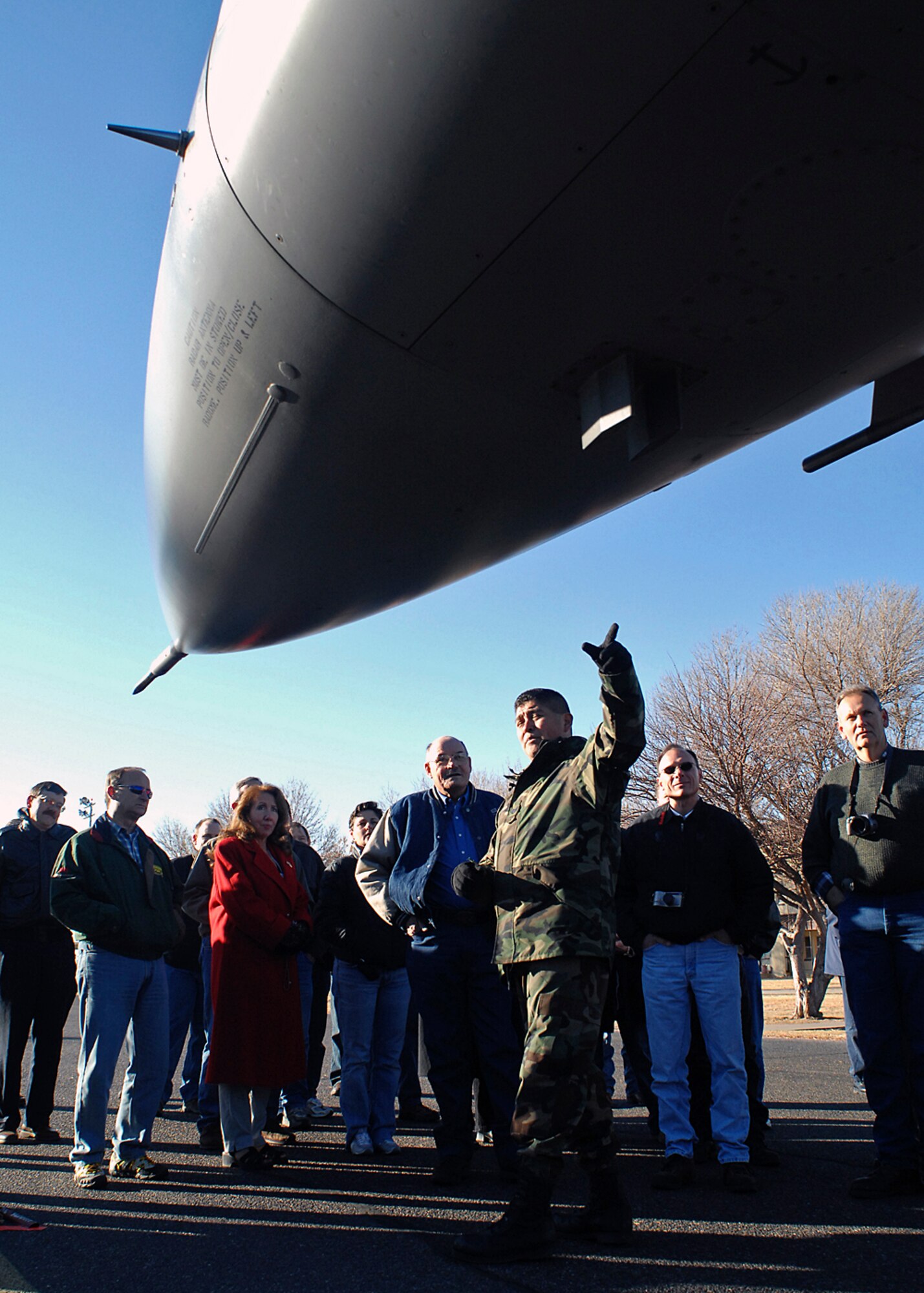 KIRTLAND AIR FORCE BASE, N.M. -- Tech. Sgt. Rickey Martinez from the 150th Fighter Wing talk with Employment Support of the Guard and Reserve members about the F-16 fighter. The ESGR group came from Texas and stopped to tour Kirtland and talk to reservists and guardsmen on Dec.7 and Dec. 8. (U.S. Air Force photo by Todd Berenger)
