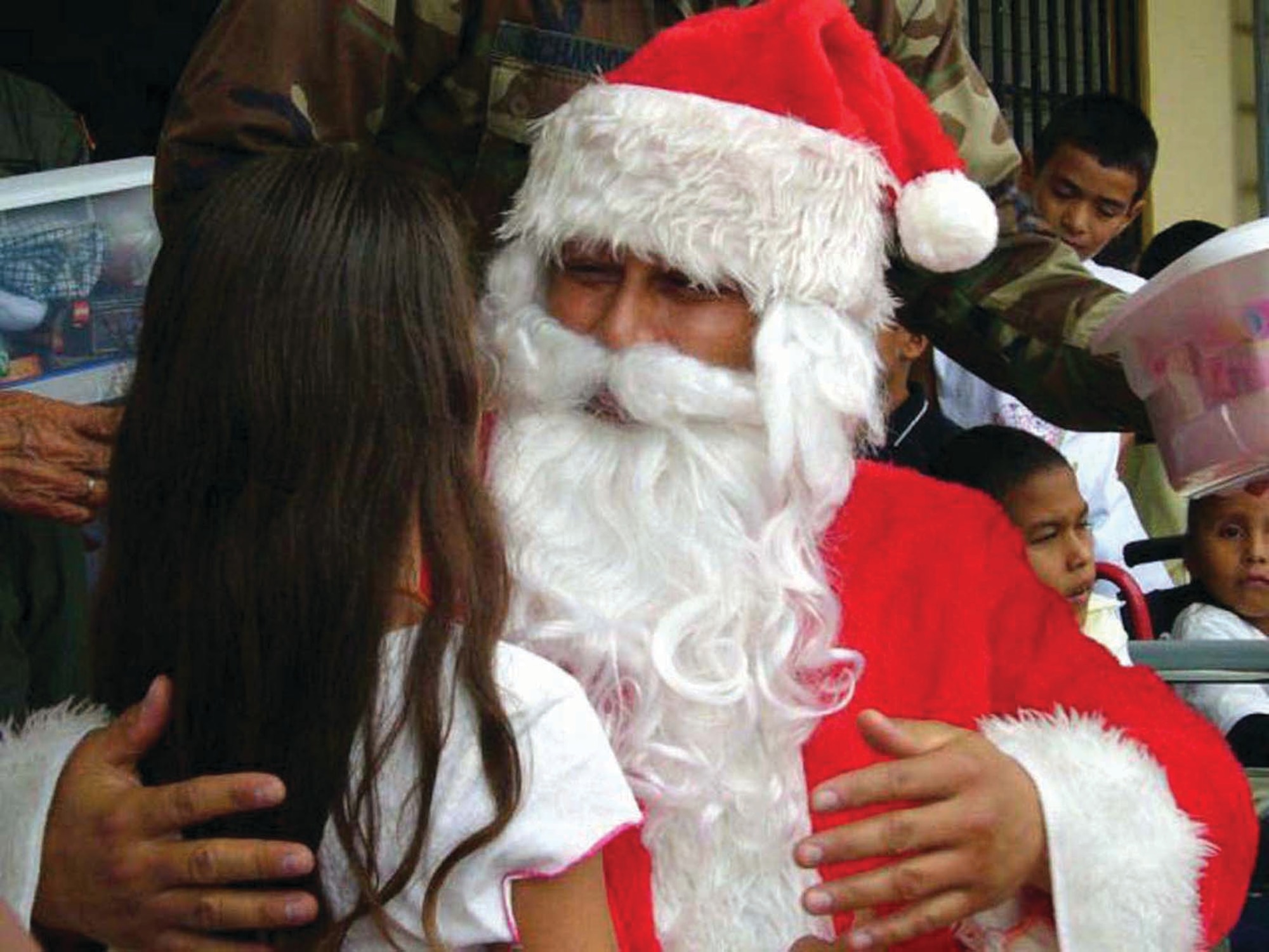 Tech. Sgt. Norman Padilla Cruz, played Santa Claus during Operation Christmas Wish in Honduras Dec. 12.  The 6th, 15th and 73rd Special Operations Squadrons flew a plane load of presents to the children of the five orphanages in Honduras. (U.S. Air Force Photograph by Tech. Sgt. Michael Dorsey)