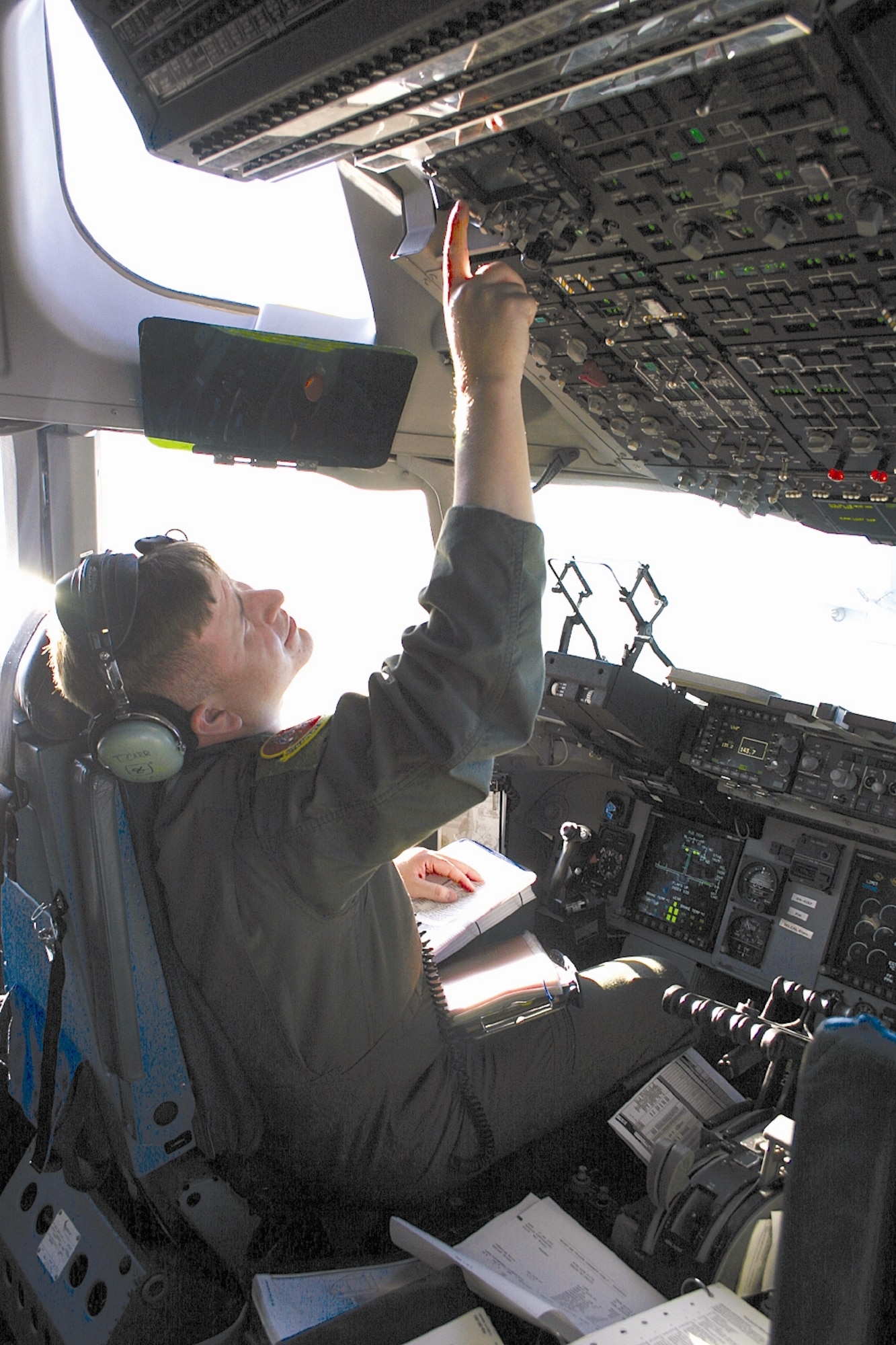 Maj. Tony Carr, 10th Airlift Squadron pilot, McChord Air Force Base, Wash., and student attending training at the 57th Weapons Squadron here, prepares a C-17 during the squadron’s training exercise at Nellis AFB, Nev. The class is set to graduate Saturday after five-and-a-half months of training to become weapons officers. U.S. Air Force Photo by Airman Rebekah Phy