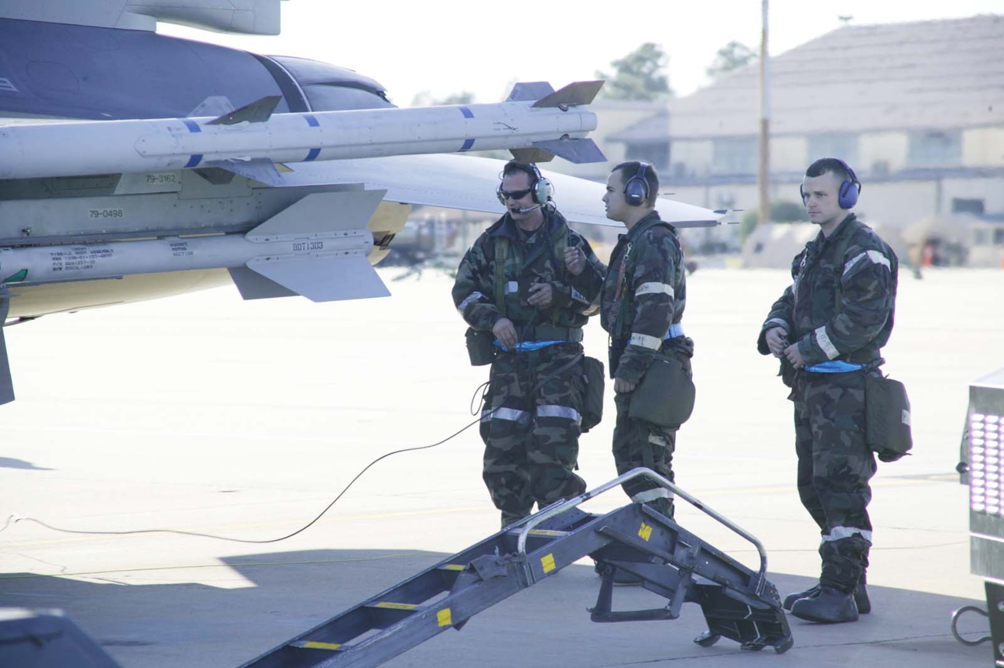 SHAW AIR FORCE BASE, S.C. -- Crew chiefs from the 77th and 55th Aircraft Maintenance Units prepare to service a jet after a sortie Dec. 5 during the operational readiness exercise.  (U.S. Air Force photo/Senior Airman Holly MacDonald)