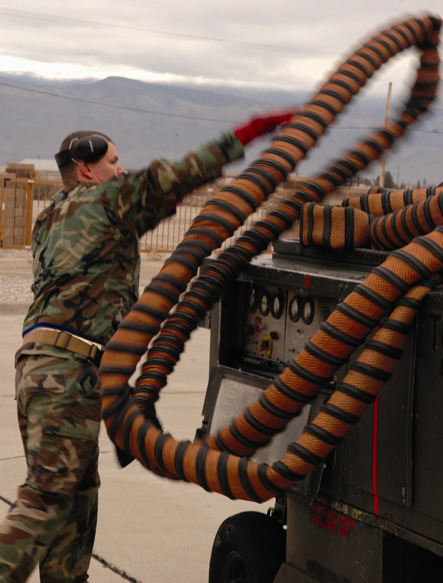 Staff Sgt. Christpoher Croley, 9th Aircraft Maintenance Unit, puts away tubing from a stray voltage check during the Weapons Load Crew of the Quarter competition Dec. 8. Sergeant Croley is the load crew chief of the winning team. (U.S. Air Force photo by Airman Jamal Sutter)