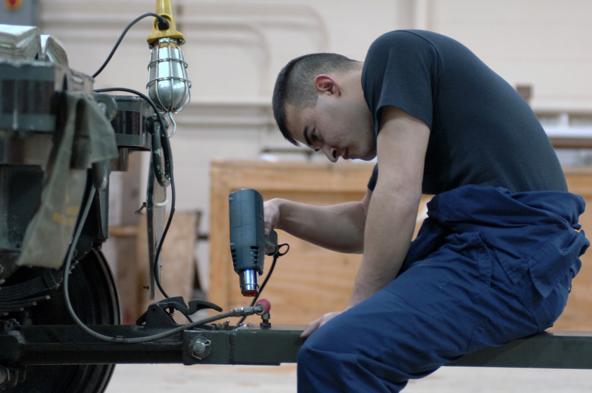 EIELSON AIR FORCE BASE, Alaska -- Airman Jaime Valle, 354th Maintenance Squadron, 354th Fighter Wing, works on the tounge assembly during a 365 inspection on an MHU-141/M Munitions Handling Trailer here on 13 December. The inspection is a yearly operational and maintenance check on the trailer which can be configured to carry different munition types.
(U.S. Air Force Photo by Staff Sgt Joshua Strang)