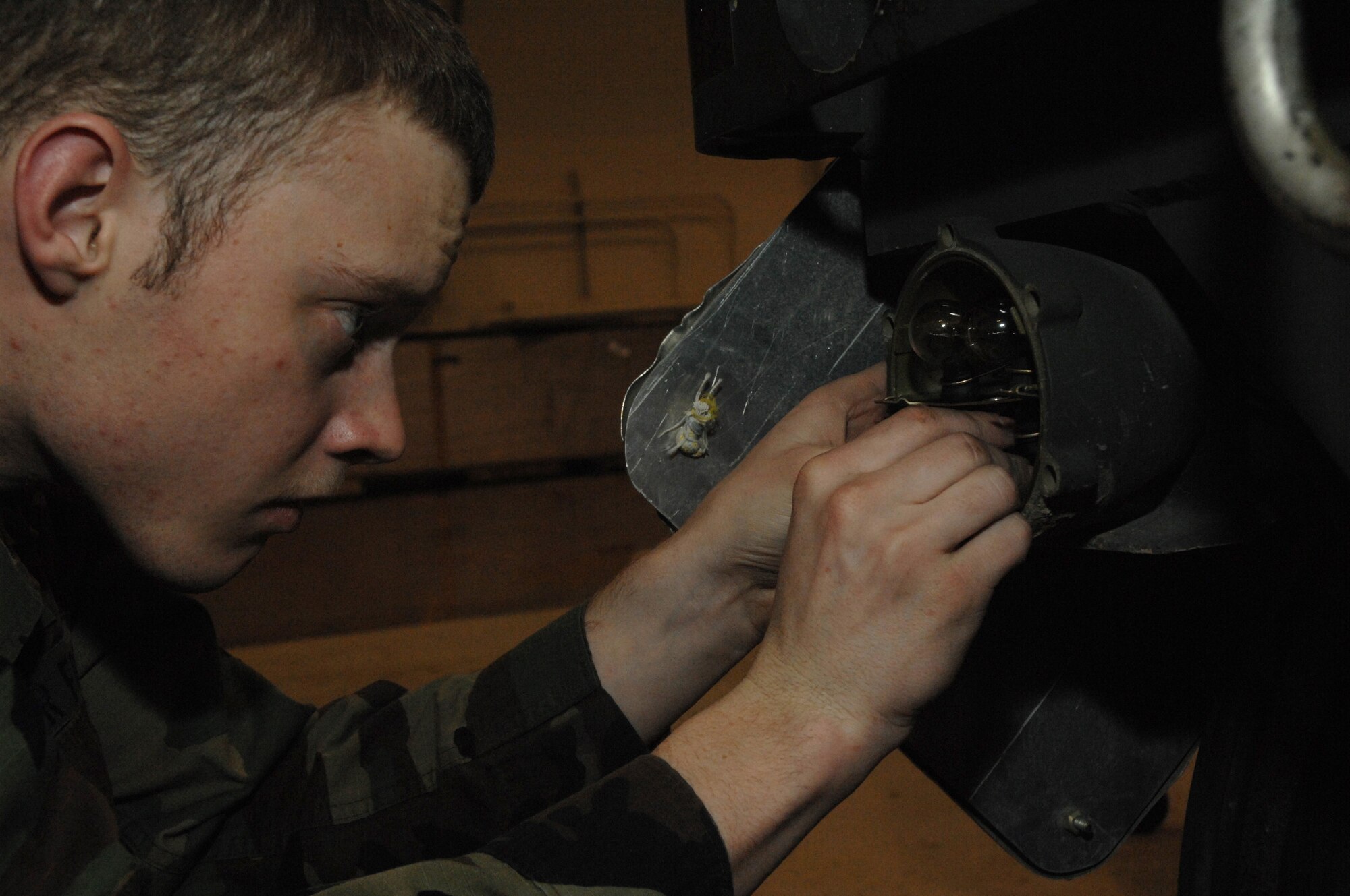 EIELSON AIR FORCE BASE, Alaska --  Airman First Class Daryl Mitchell, 354th Maintenance Squadron, 354th Fighter Wing, inspects a brake light assembly during a 365 inspection on an MHU-141/M Munitions Handling Trailer here on 13 December. The inspection is a yearly operational and maintenance check on the trailer which can be configured to carry different munition types. 
(U.S. Air Force Photo by Staff Sgt Joshua Strang)