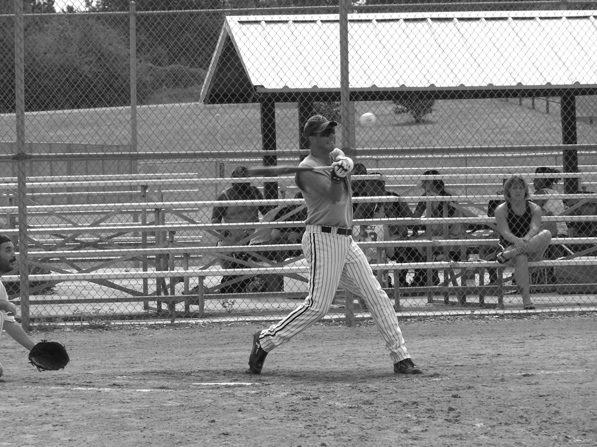 PANAMA CITY, Fla. --  Master Sgt. William Johnson slams the ball for a base hit during a playoff game July 30. Tyndall's 325th Maintenance Squadron munitions flight softball team won the eastern Ammo Bowl July 31, beating the  Eglin AFB, Fla., team 46-36 in the championship game. (Photo by Senior Airman Thomas Mendiola)