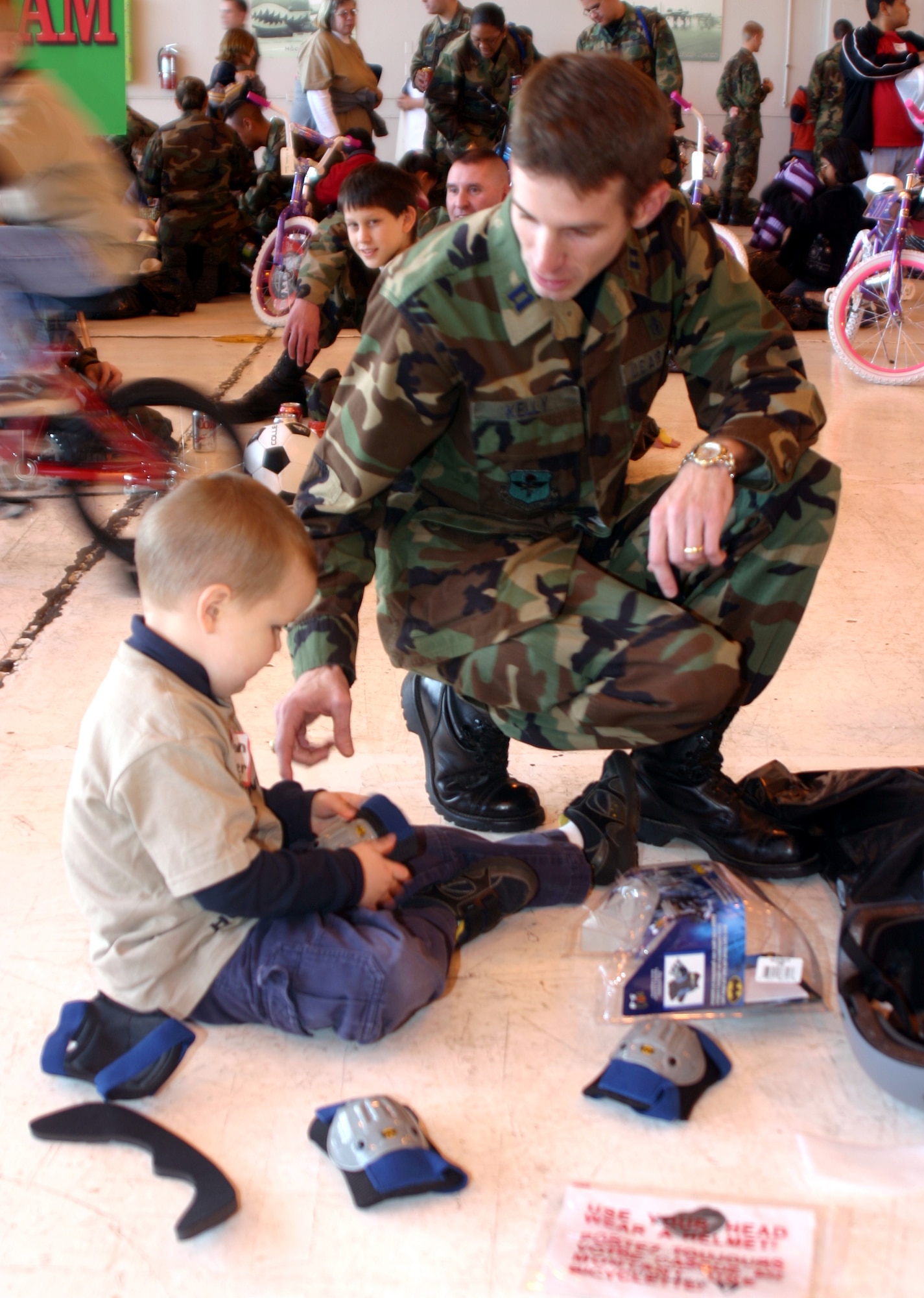 Preston Esslinger opens presents at the annual Give a Child a Christmas party Dec. 8. Capt. Jason Kelly, 82nd Medical Operations Squadron, was one of many who sponsored a child. (U.S. Air Force photo/Airman Jacob Corbin)