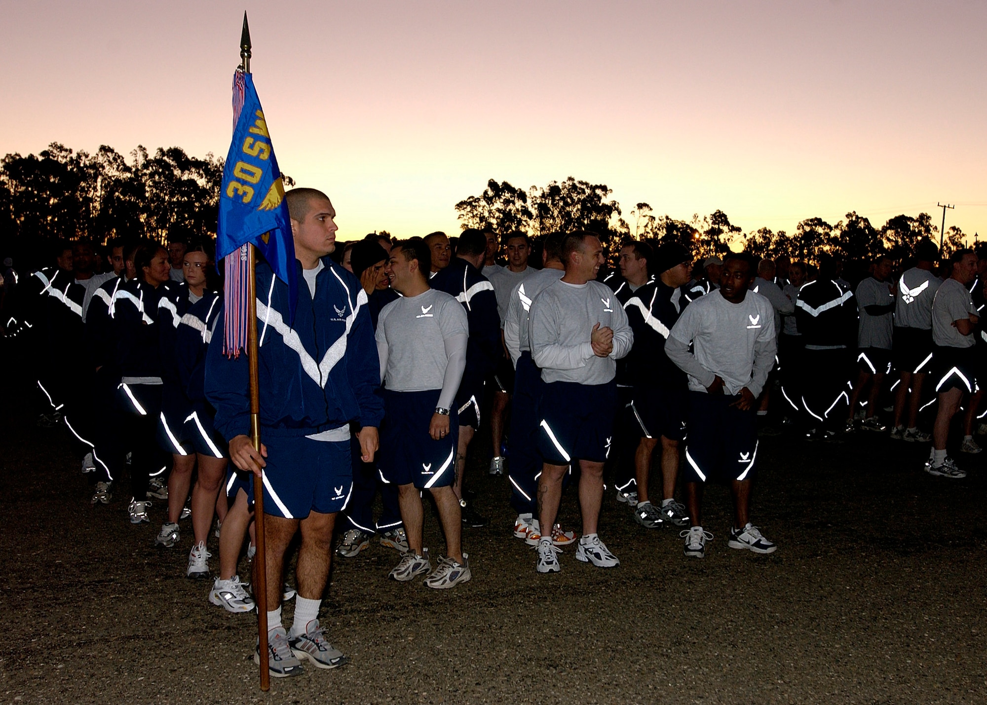 Members of the 30th Space Wing form up in preparation for the wing's monthly Fit to Fight run December 7, 2006 here. The five-kilometer run takes place on the first Thursday of every month.  (U.S. Air Force photo by Airman 1st Class Stephanie Longoria)